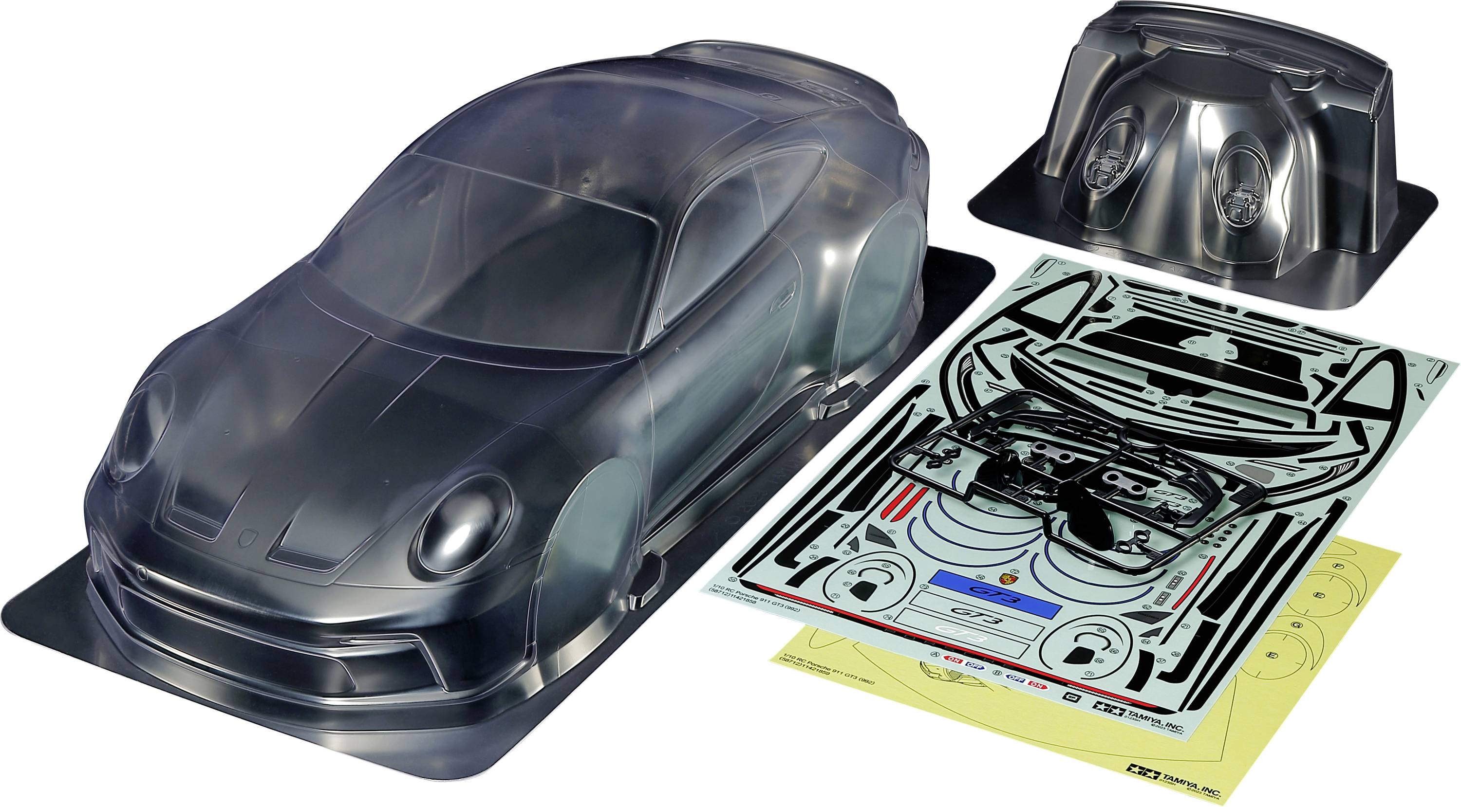 Model kit of a transparent plastic car, including decal sheets with decorations and details for customised design.
