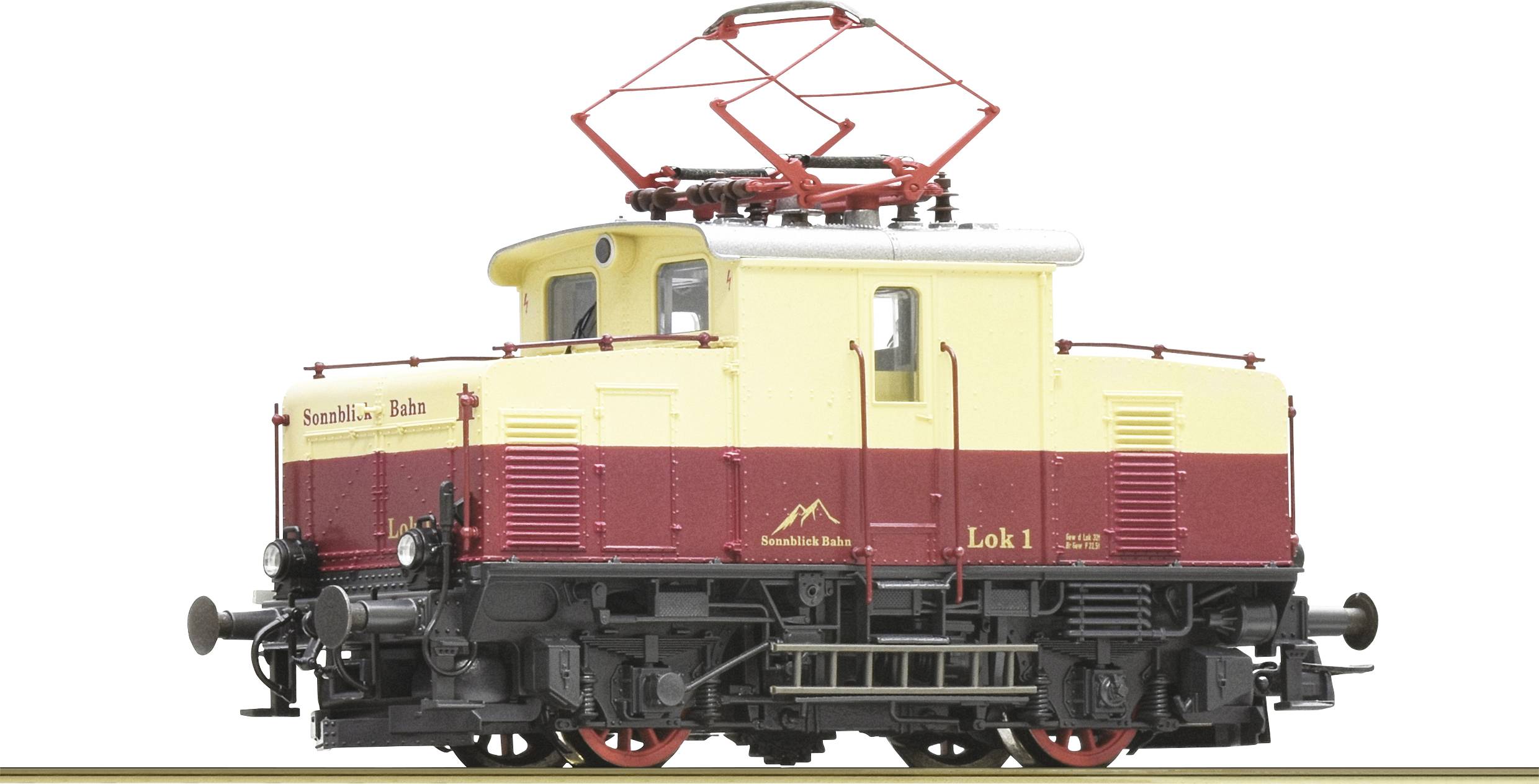 Yellow and red model of an electric locomotive with the inscription 'Sennalpe Railway Locomotive 1'. The locomotive has a pantograph.