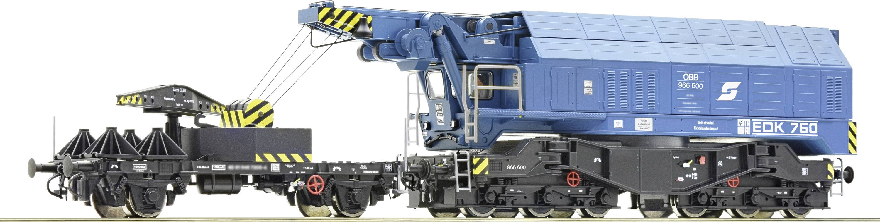 Toy model of a blue railway slewing crane with a black trailer, presented against a neutral background.
