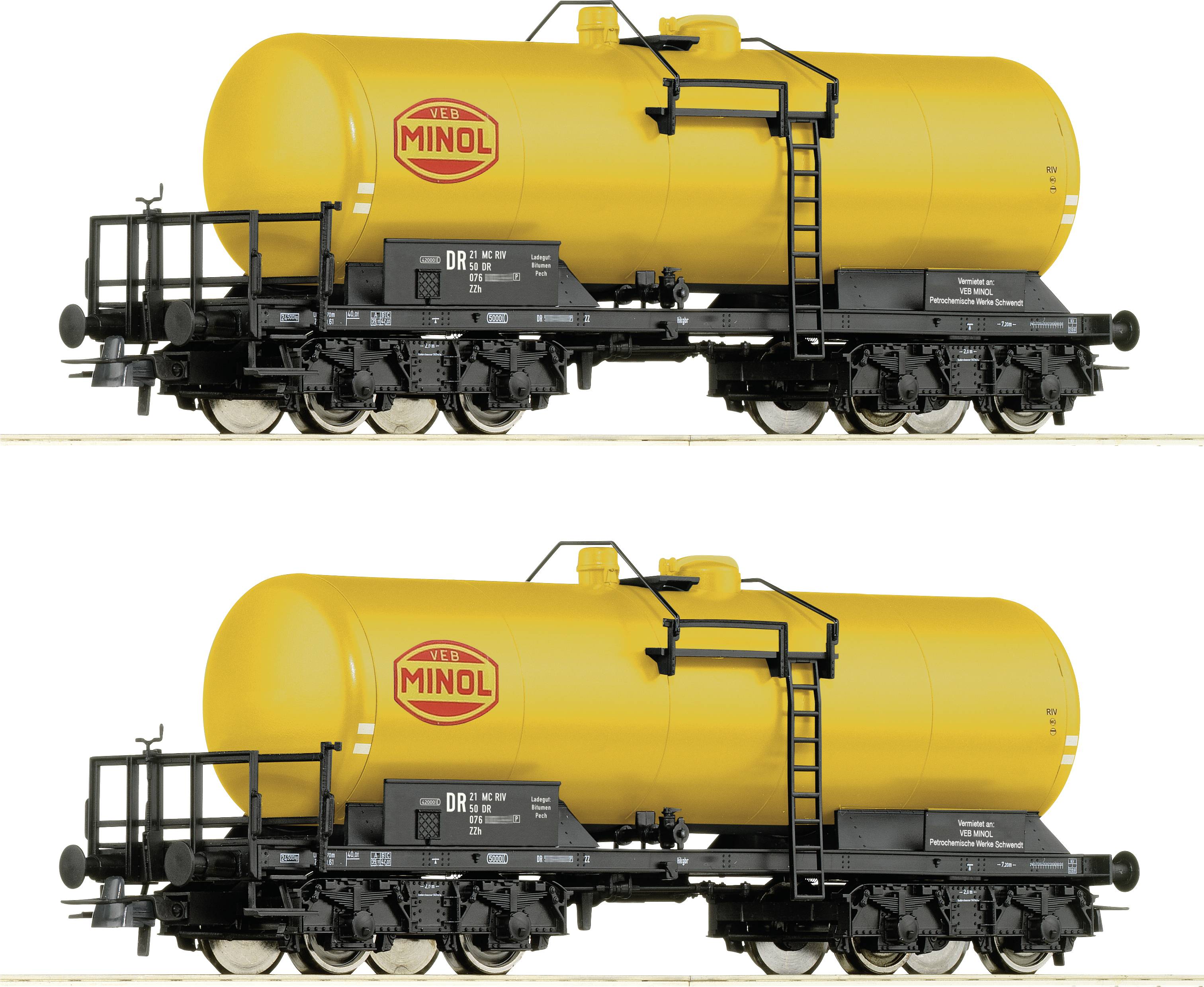 Two yellow tanker wagons with 'Minol' written on their sides, featuring black details, are standing on railway tracks.