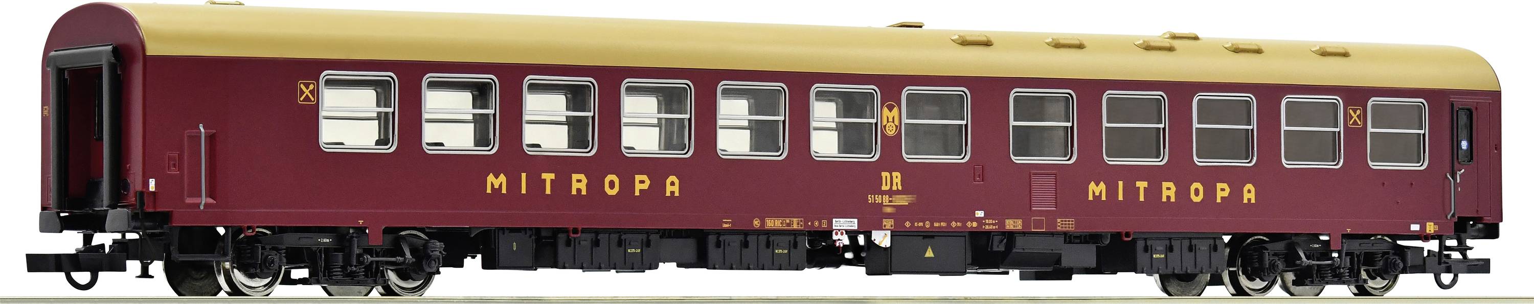 A red model train Mitropa carriage with a yellow roof and 'MITROPA' inscription. The carriage has numerous windows and is intricately designed.