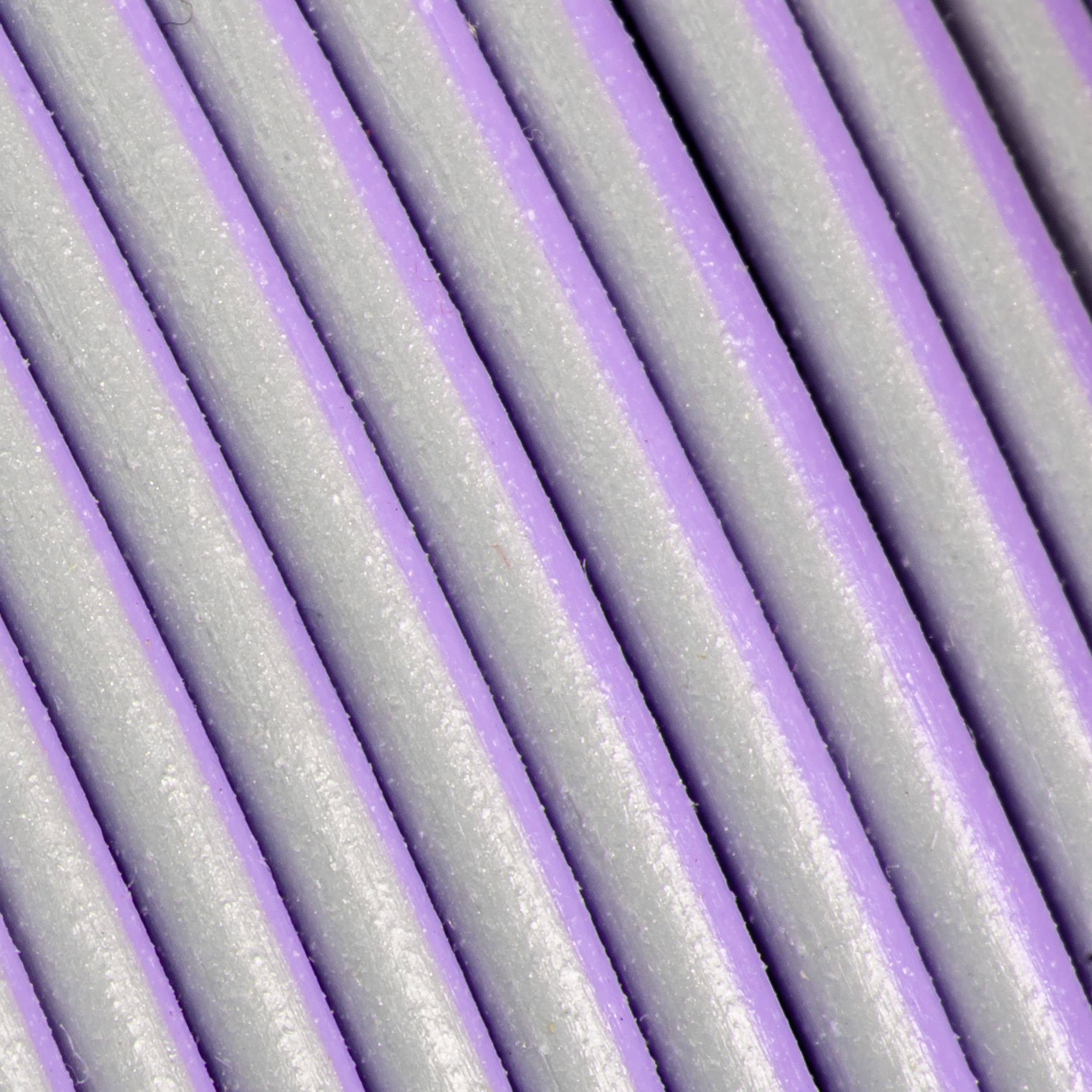 Close-up of gray cables or wires running parallel to each other.