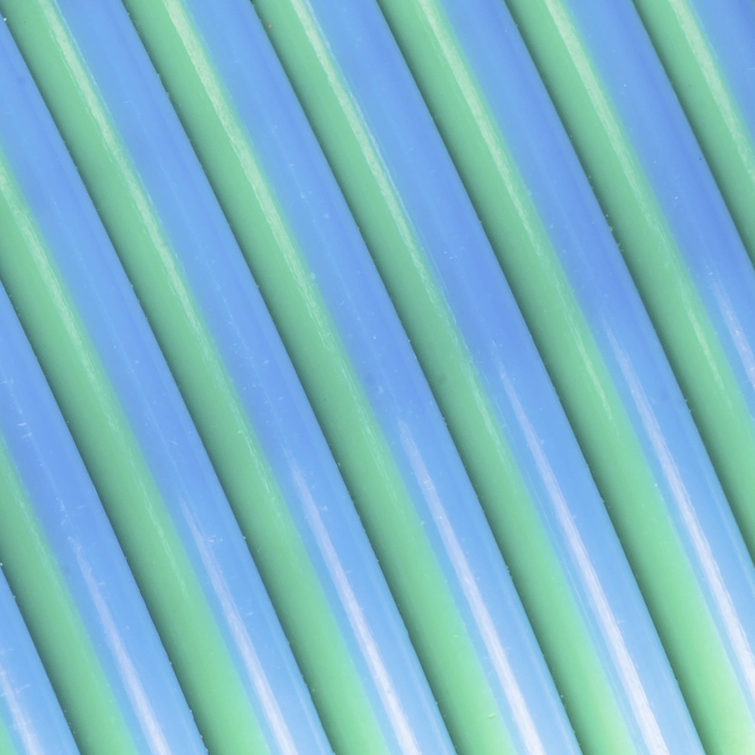 Blue and green parallel lines run diagonally across the image, creating a symmetrical, striped pattern.