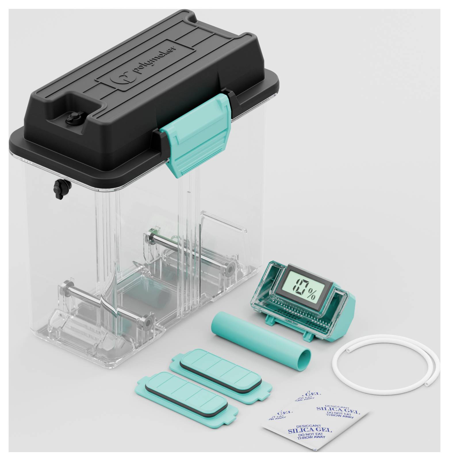 A transparent plastic box with a black lid and turquoise closures; contains a hygrometer and silica gel packets.