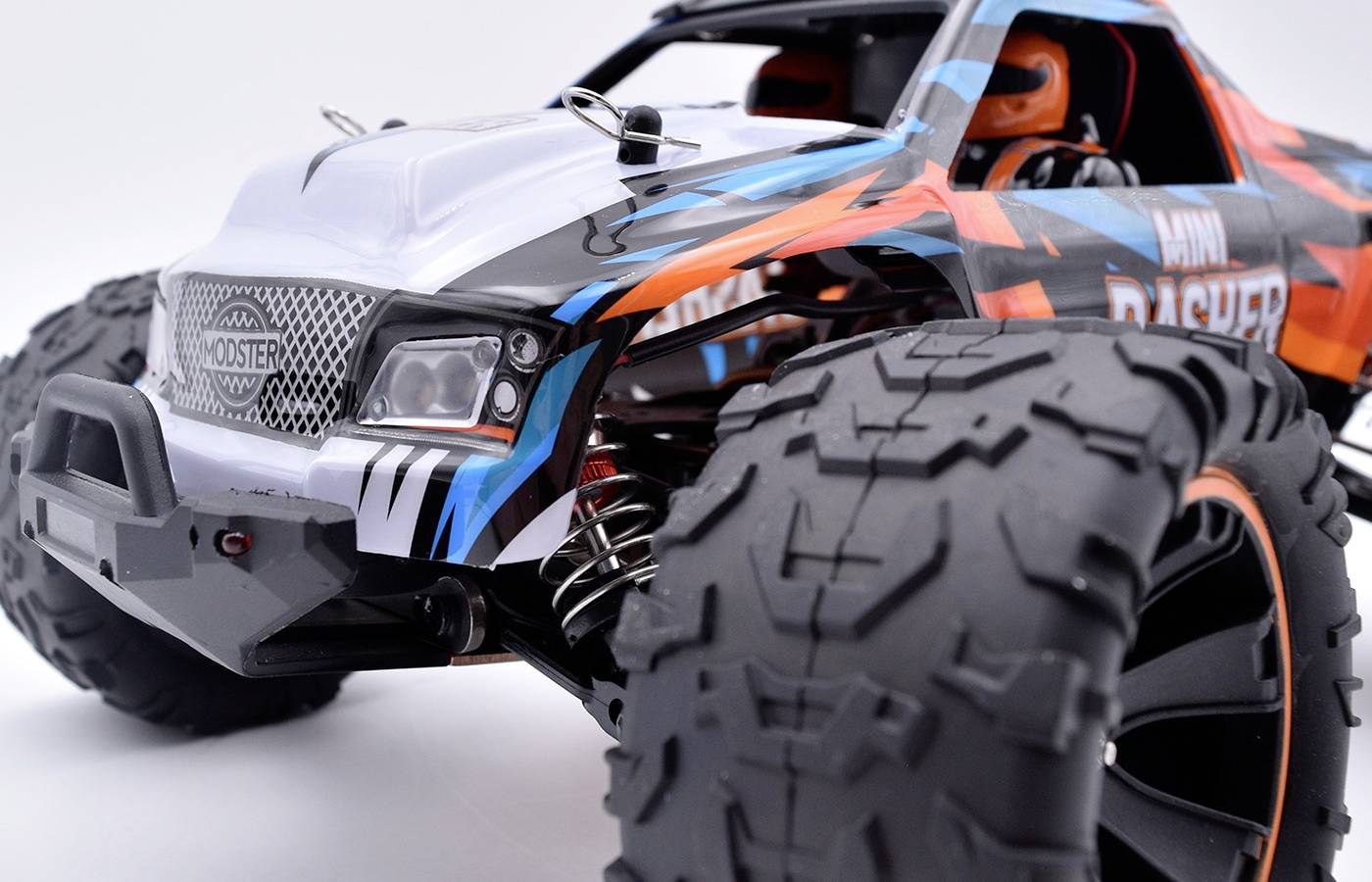 Toy car in an off-road style with large, chunky tyres and a colourful, eye-catching design.