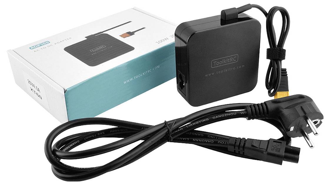 Shown is a black charger with power cable and packaging. The inscription reads 'ToolKitRC'.