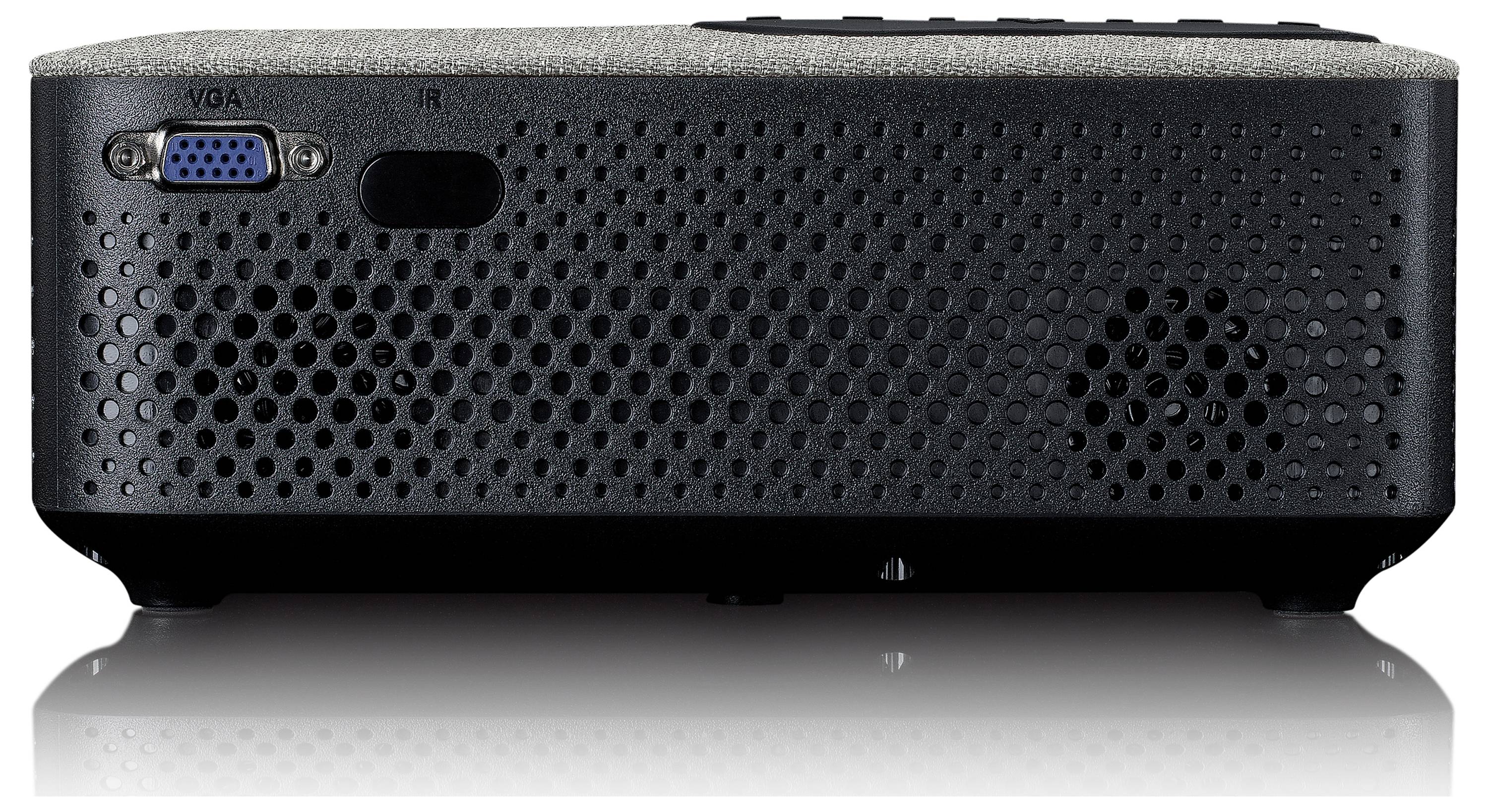 A projector with a VGA port and ventilation slots on the side. It is placed on a reflective surface.