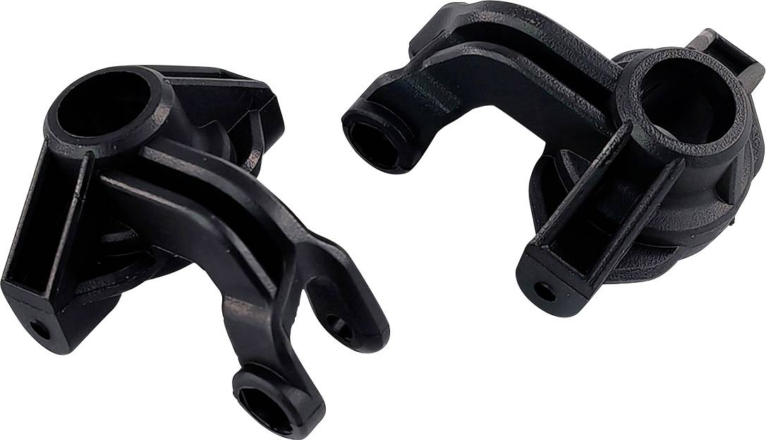 Two black plastic components, likely parts of a machine or vehicle assembly kit, with recesses and mounting points.