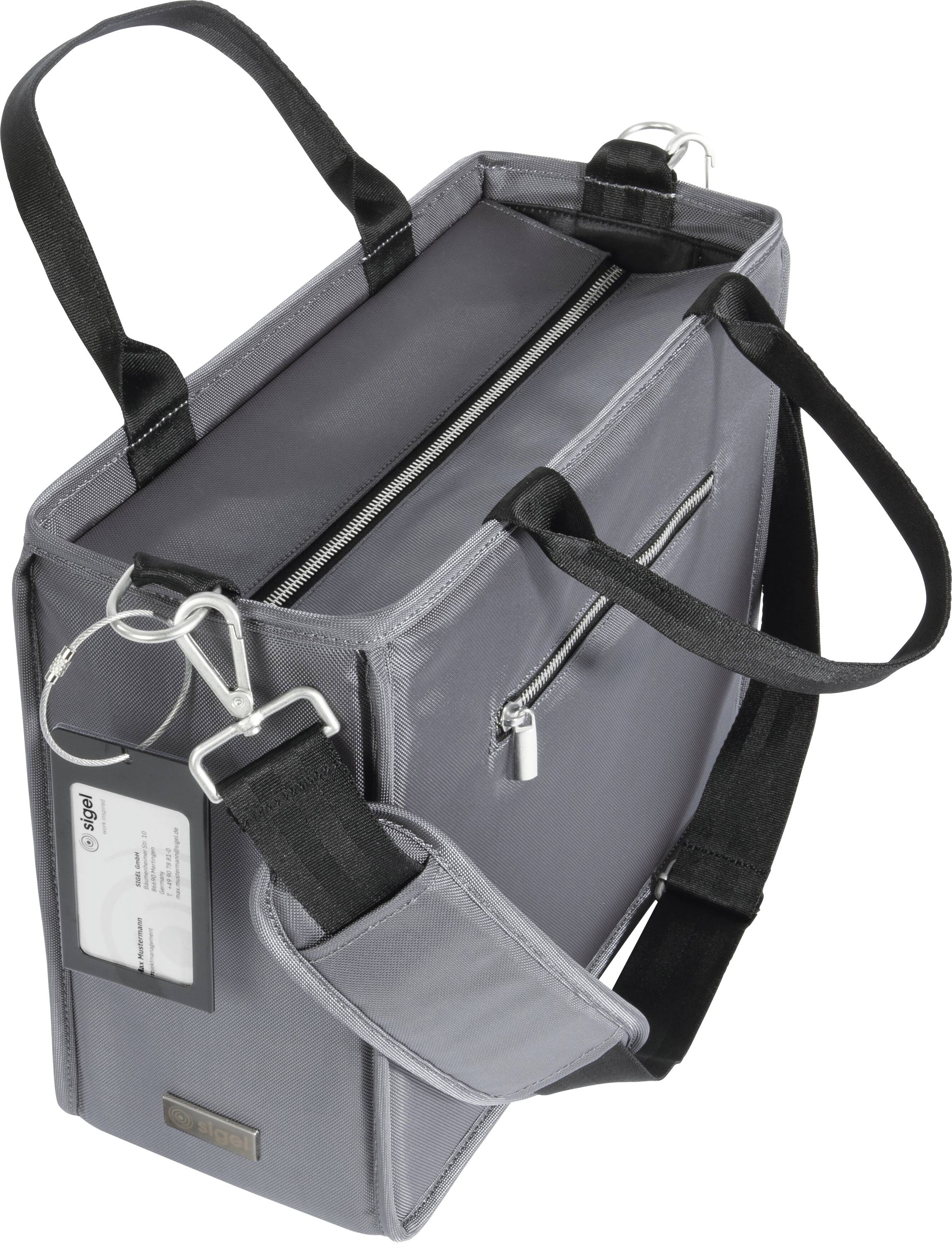 A grey, rectangular bag with black handles and a zip, displaying a name tag on the side.