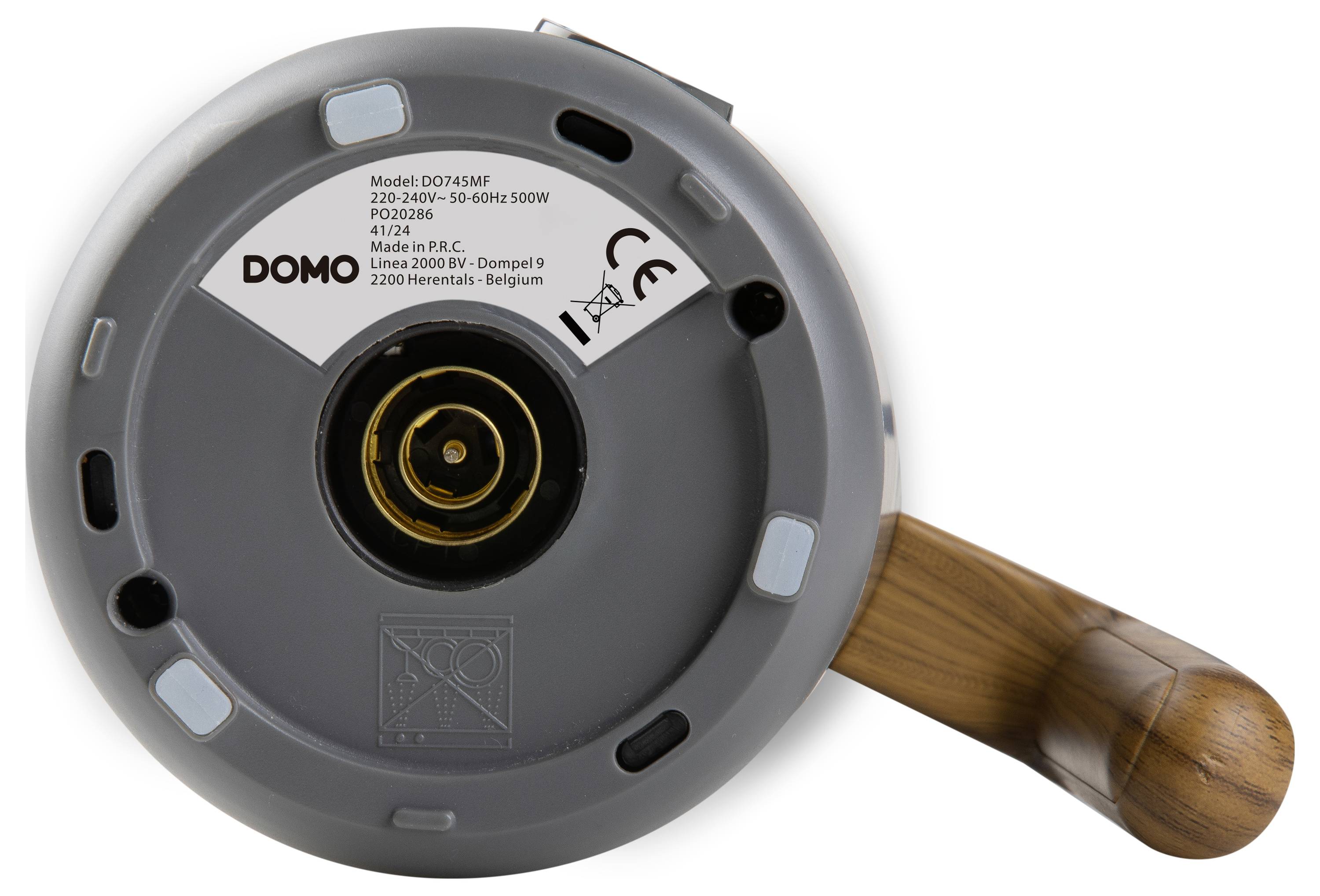 Underside of an electrical device with a label 'DOMO', model number, manufacturing details and inspection seal. Wooden handle visible.