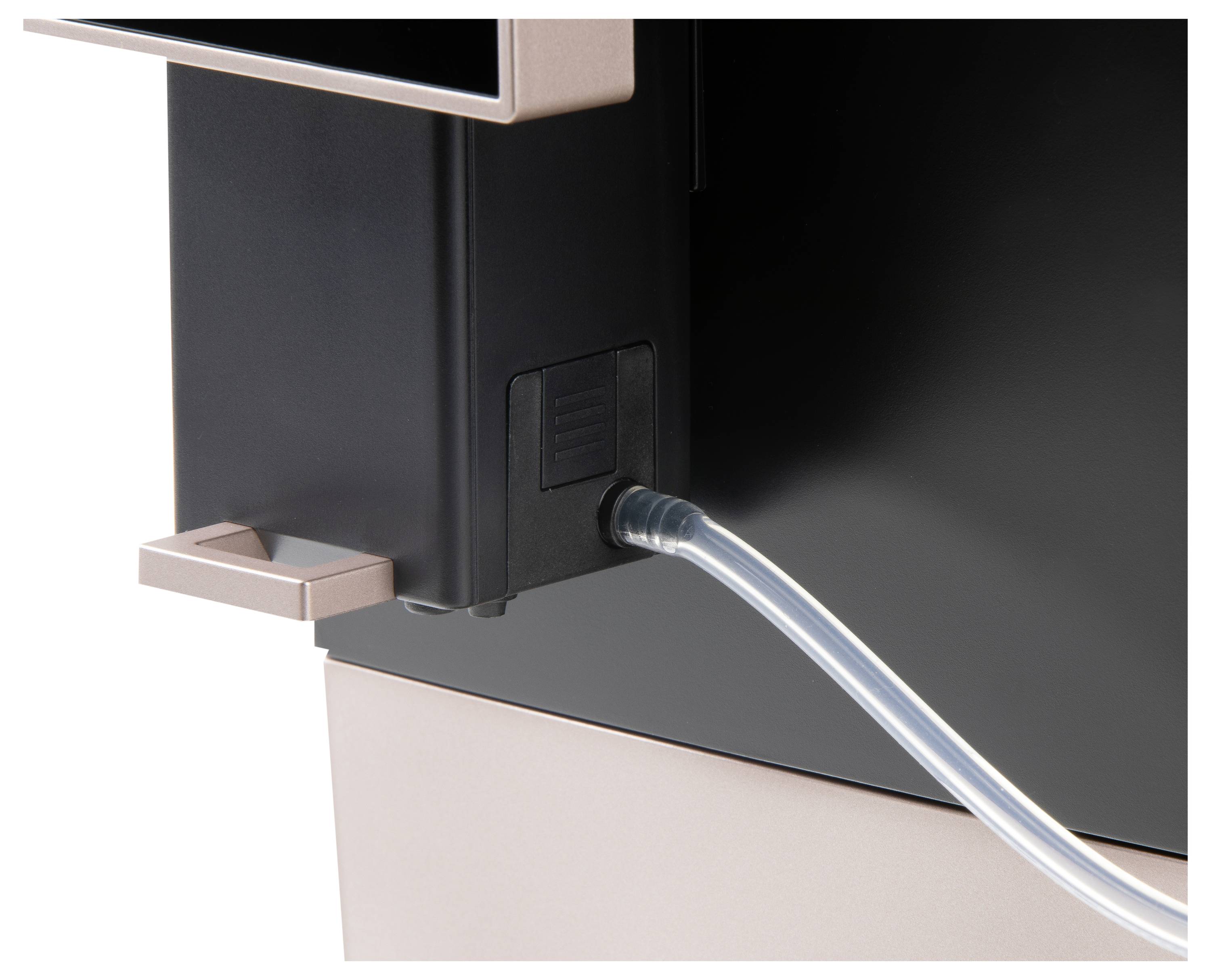 Close-up of a device with an attached transparent tube. Part of a machine, possibly for liquid flow.