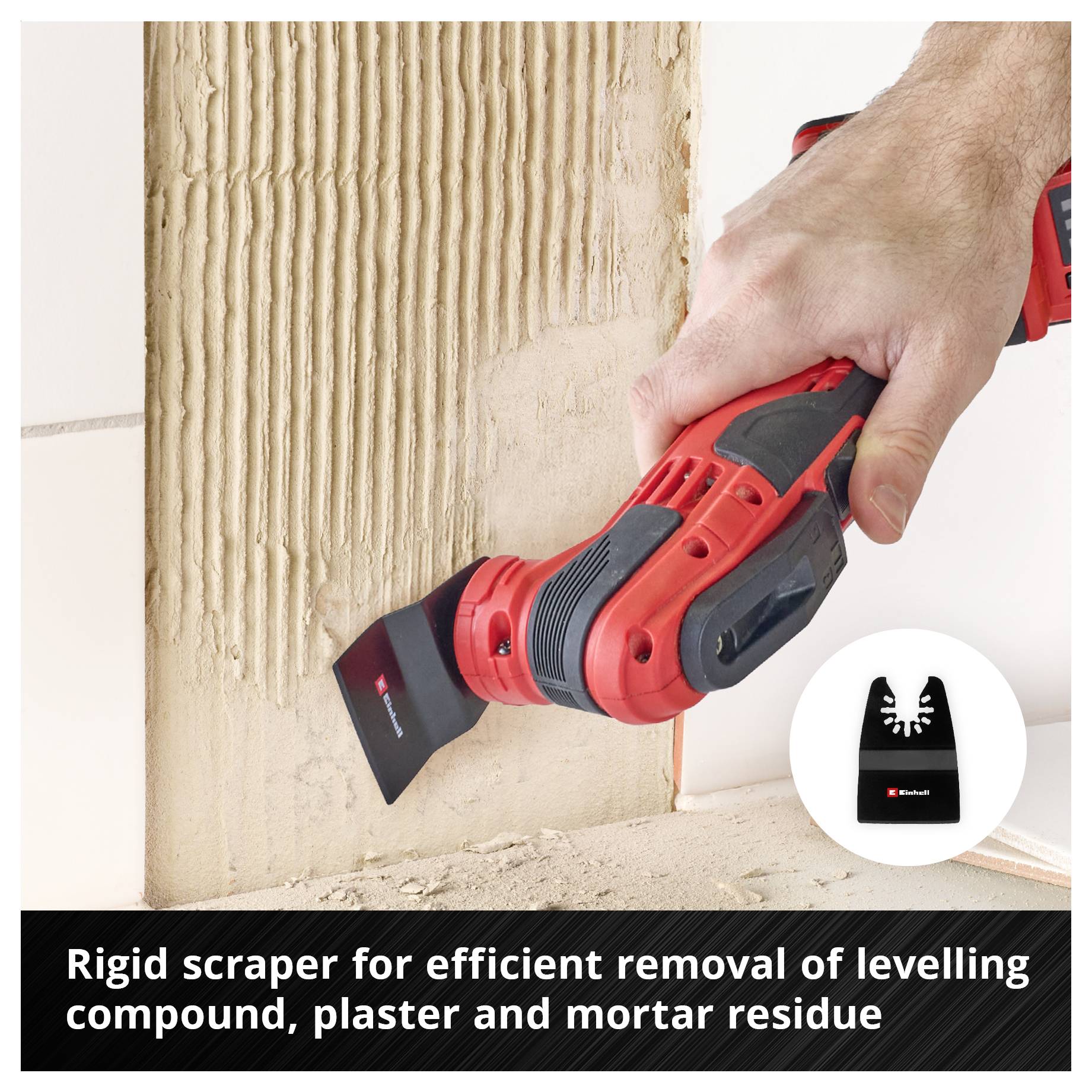 Hand holds electric scraper being used to remove filler and mortar residue from a wall.