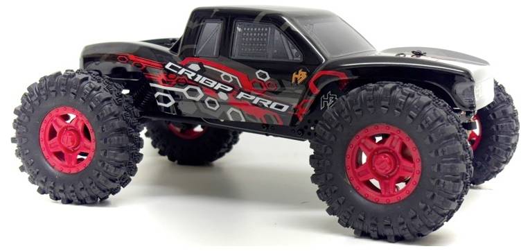 A remote-controlled car with large red tyres and a black and red bodywork design, viewed from the side.
