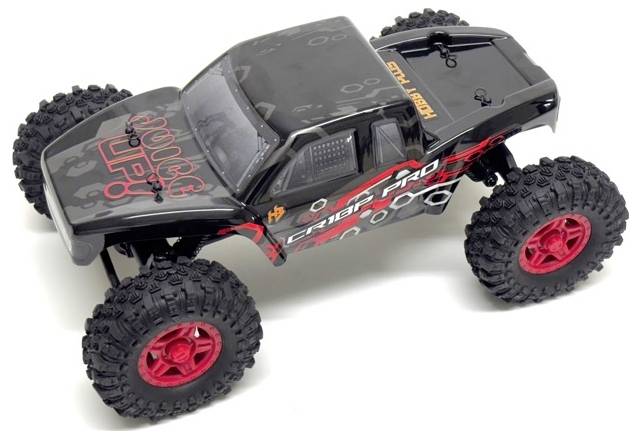 A black remote-controlled car with red alloy wheels and chunky tyres. The bodywork features red and orange lettering.