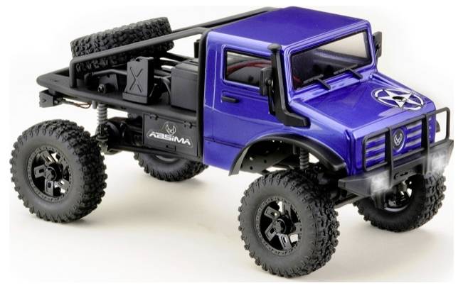 A blue toy off-road vehicle with large tyres and a spare wheel, on a rugged chassis. Model of an off-road vehicle imitation.