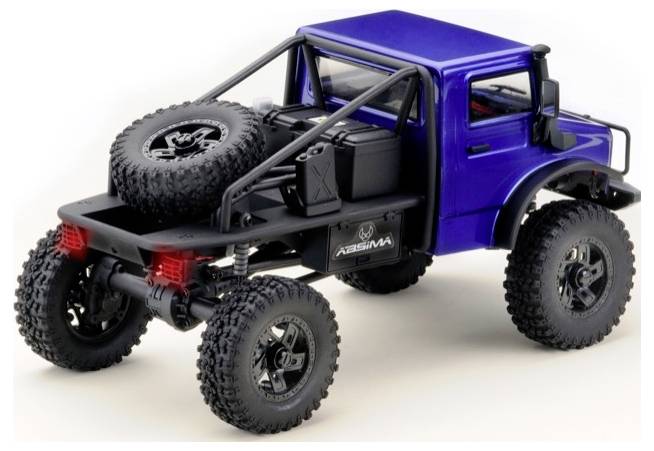 A miniature model of a blue off-road vehicle with large tyres and a spare wheel, suitable for off-road driving.