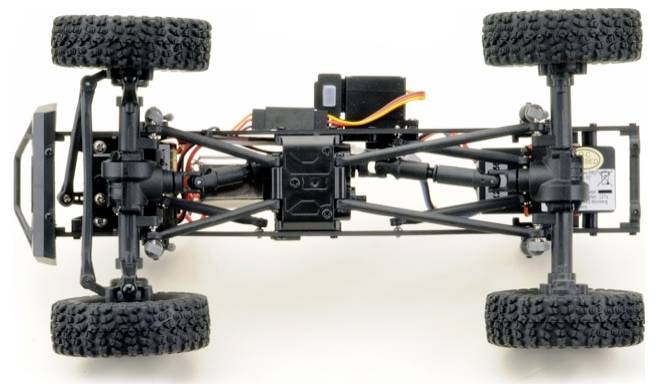Top view of a remote-controlled vehicle chassis with wheels and axles. Electronics and cables are visible.
