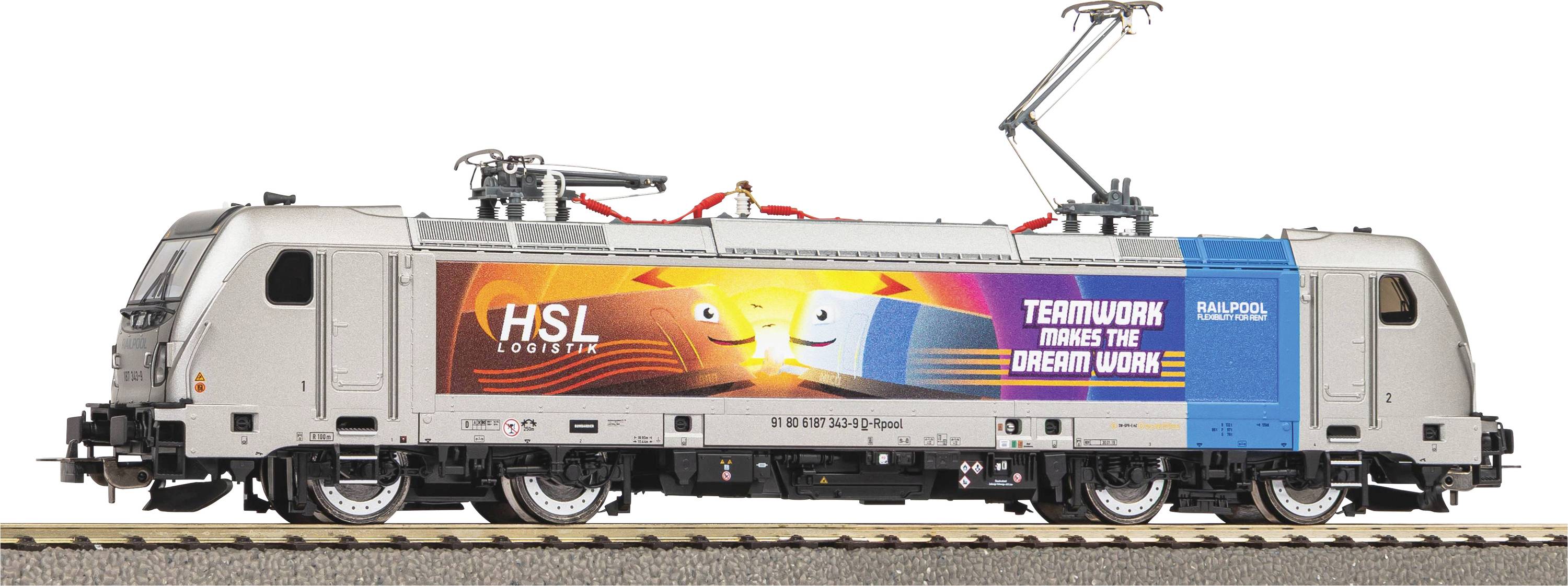 A grey freight train with advertising: 'TEAMWORK MAKES THE DREAM WORK' and friendly figures on the side. With pantograph on the roof.