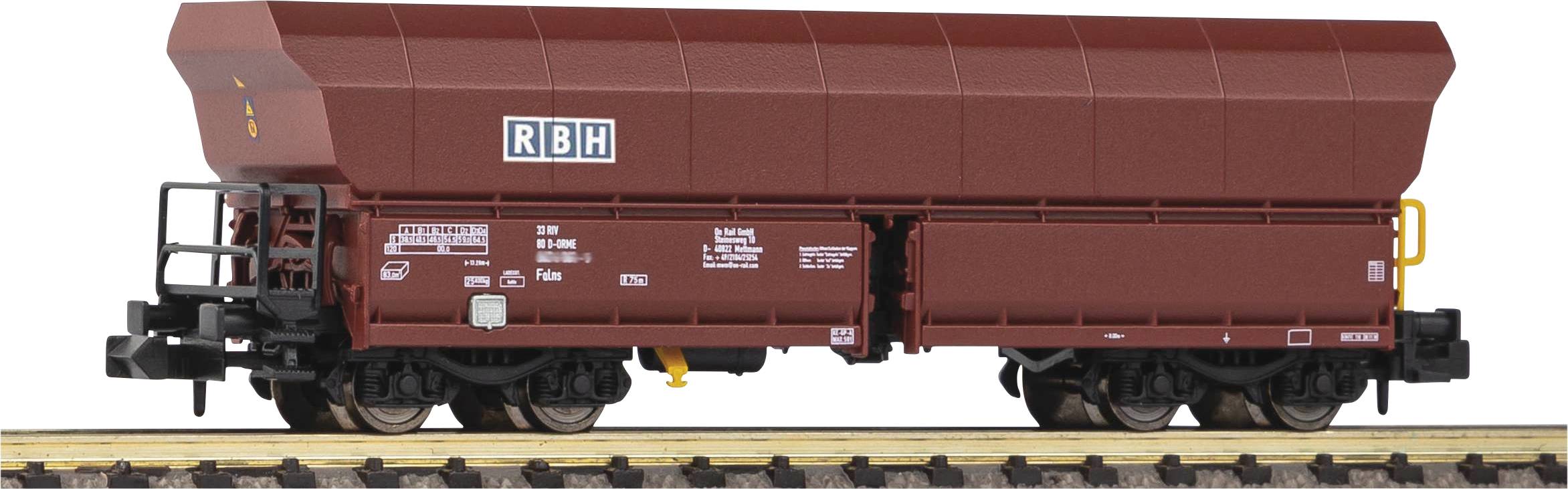A brown goods wagon by RBH on railway tracks. The wagon is empty and has a rectangular shape with a black chassis.