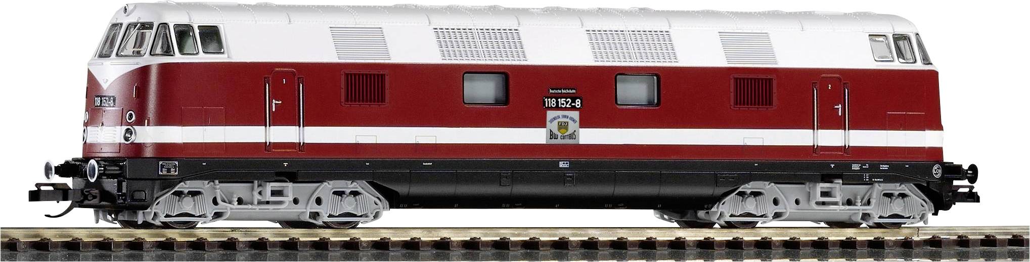 A model train of a red and white diesel locomotive travels along a section of track, detailed with windows and ventilation grilles.
