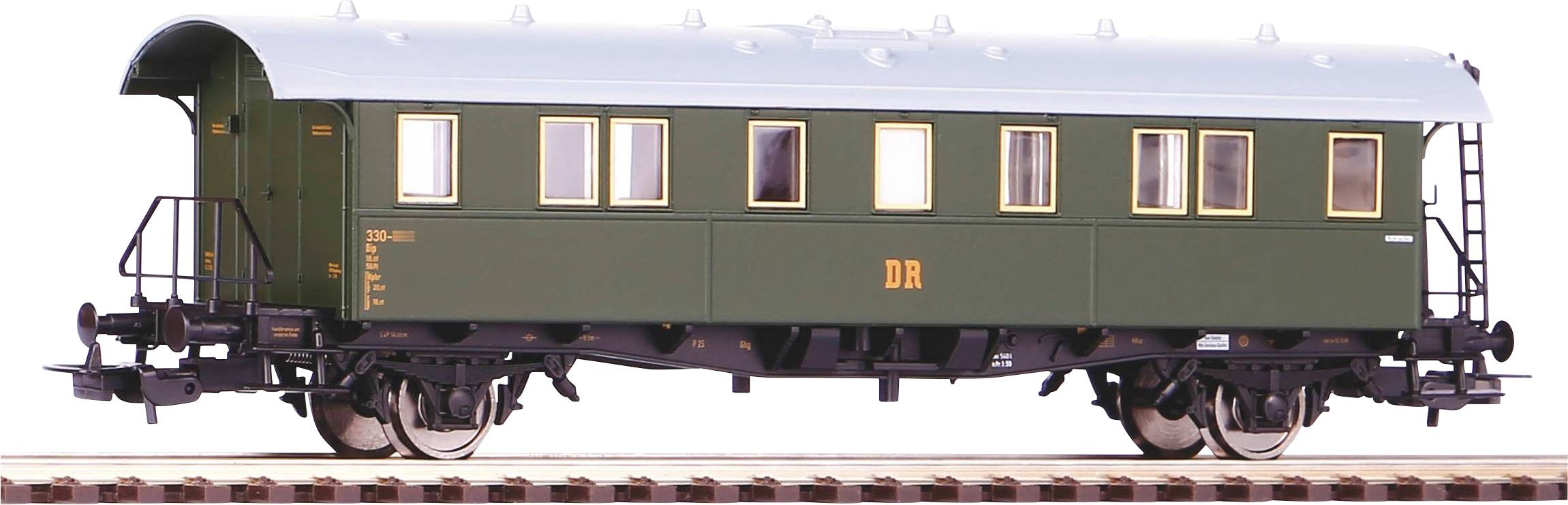 Side view of a green historical railway carriage with the inscription 'DR'. The carriage is positioned on a track. Depicted in model scale.