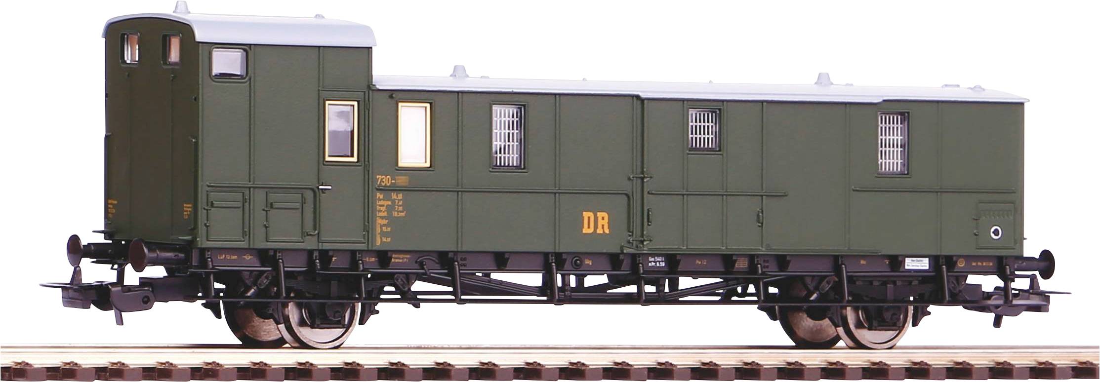 A green goods wagon of the Deutsche Reichsbahn on a railway track, side view, with detailed chassis and small windows.