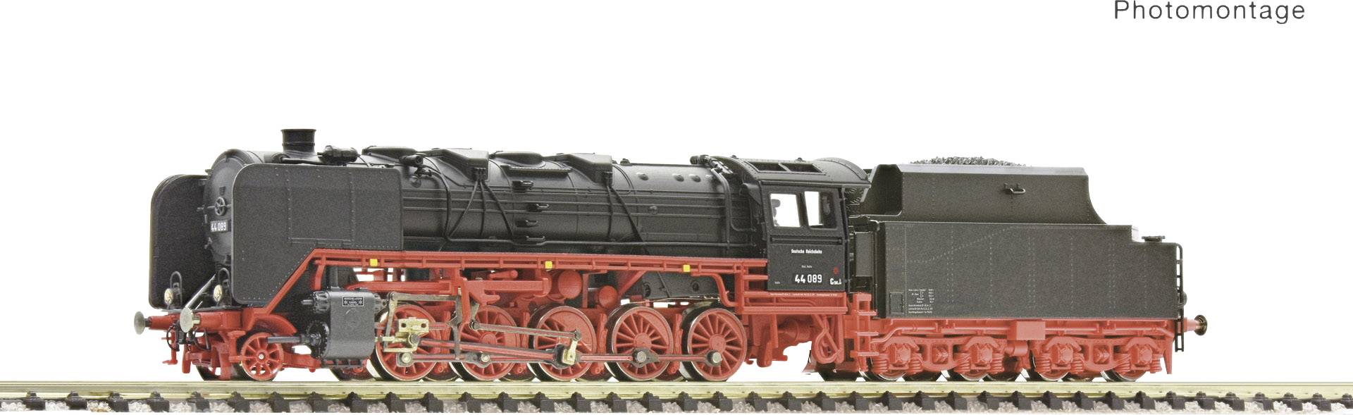 Model railway locomotive in black and red colours on a track, shown from the side. An example of historical trains.