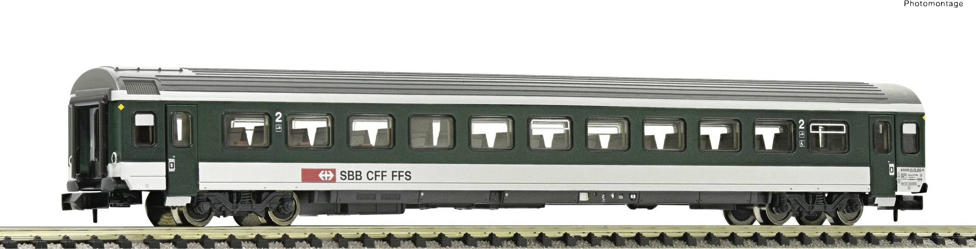 A green passenger carriage of the SBB CFF FFS with white stripes, stands on a track marked with '2'.