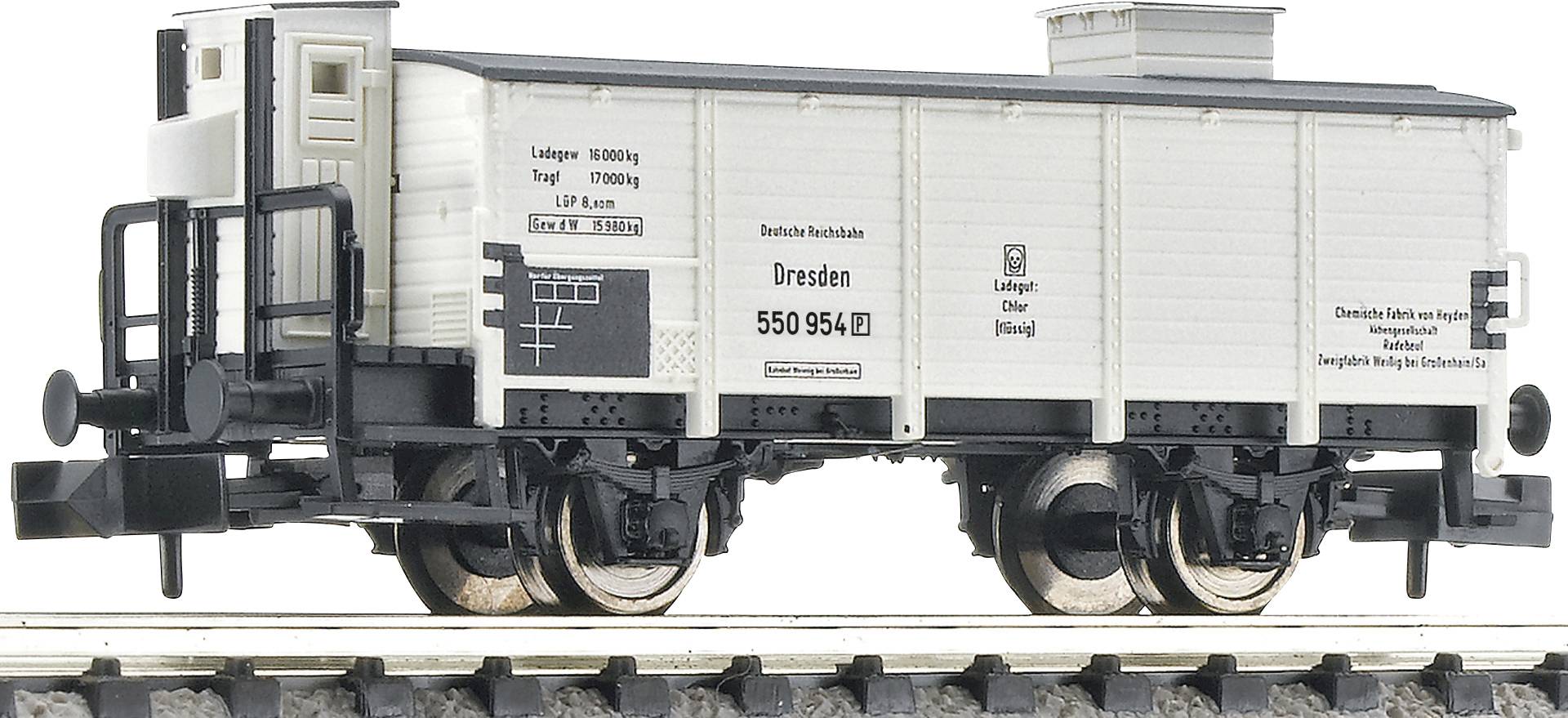 A model goods wagon on a track, painted white, with black lettering 'Dresden 550 954'. Detailed braking system visible.