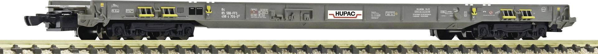 A grey railway carriage on tracks with yellow and black details. A logo reading 'NRG'.