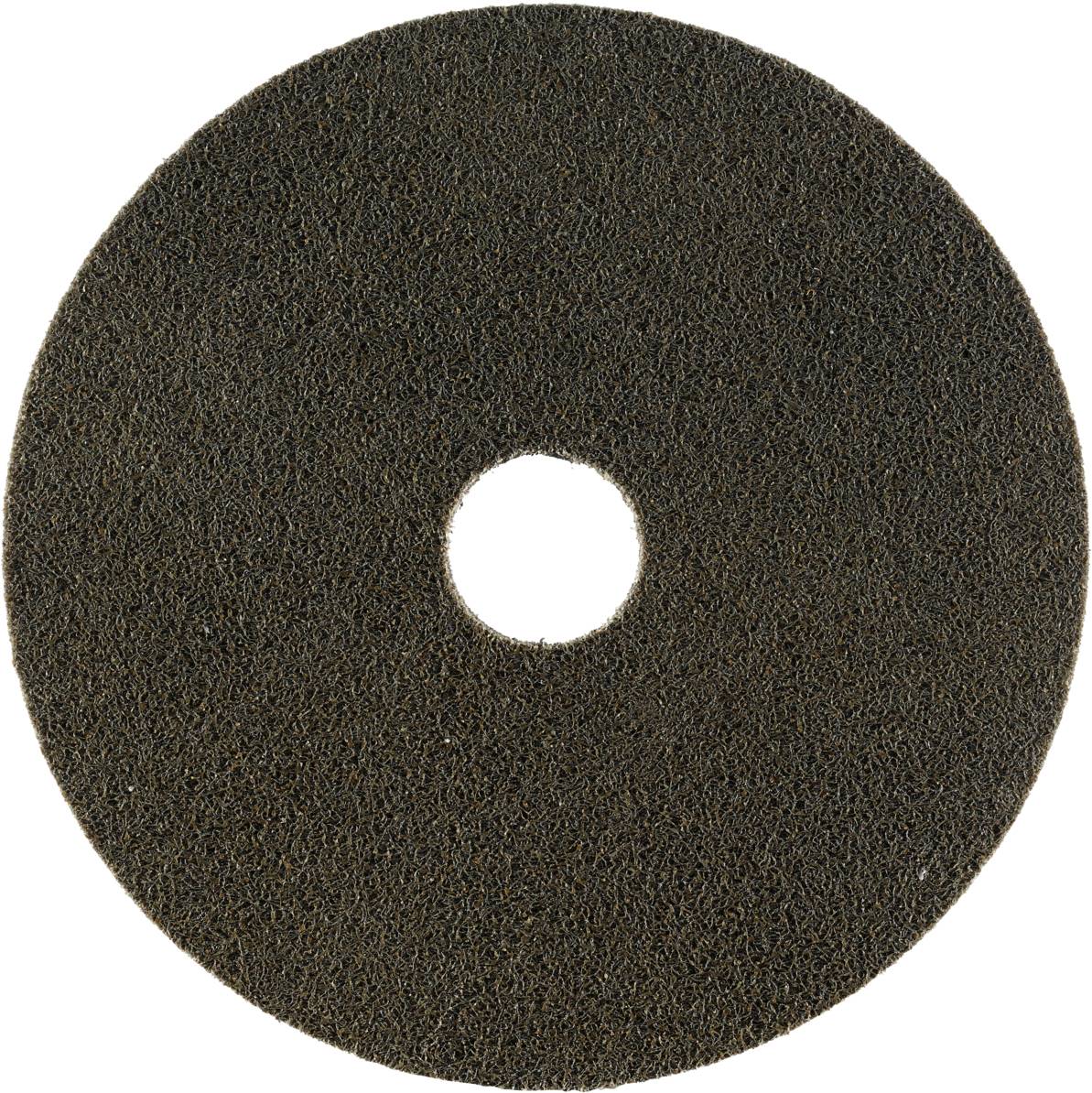A large, round grinding attachment with a rough, dark surface and a central hole, suitable for floor processing machines.