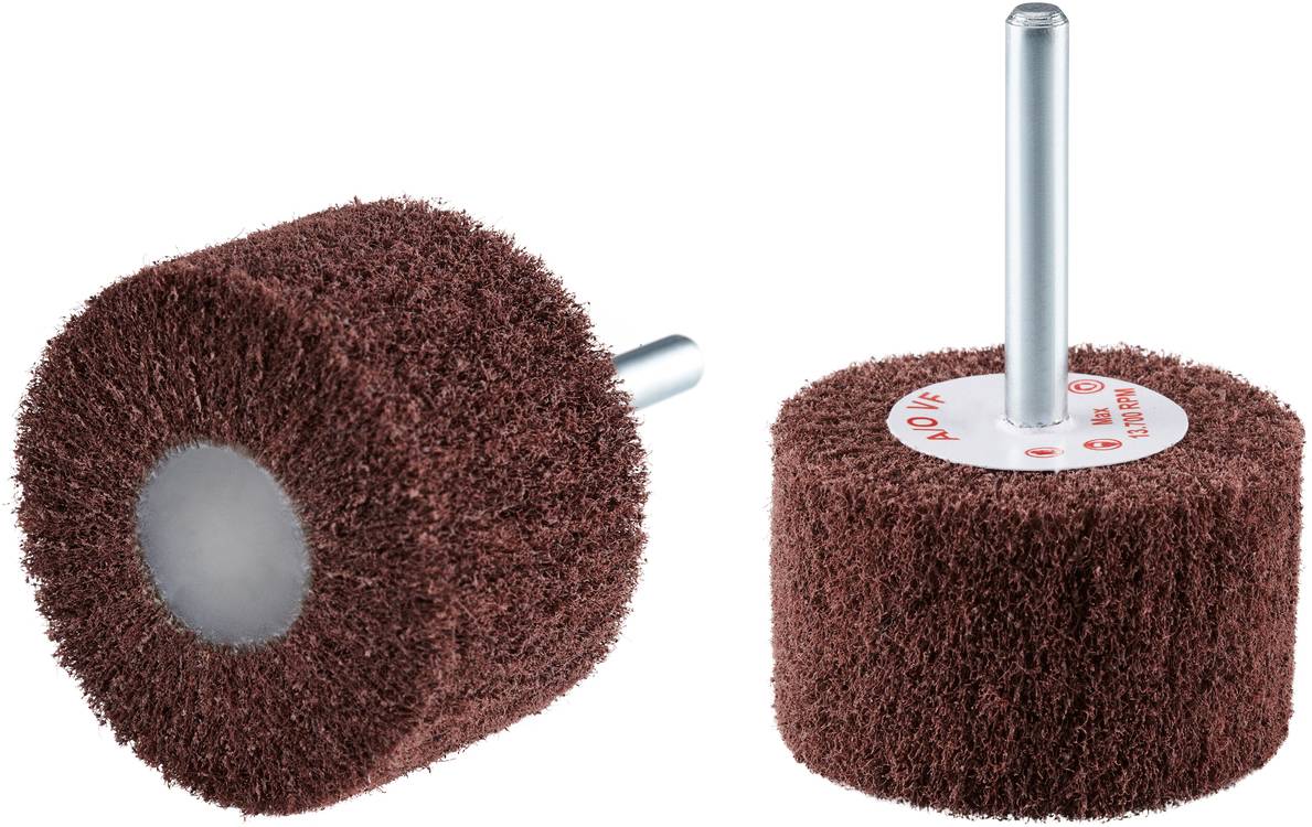 Two grinding attachments with brown fibres and metal pins lying side by side. Suitable for drilling machines.