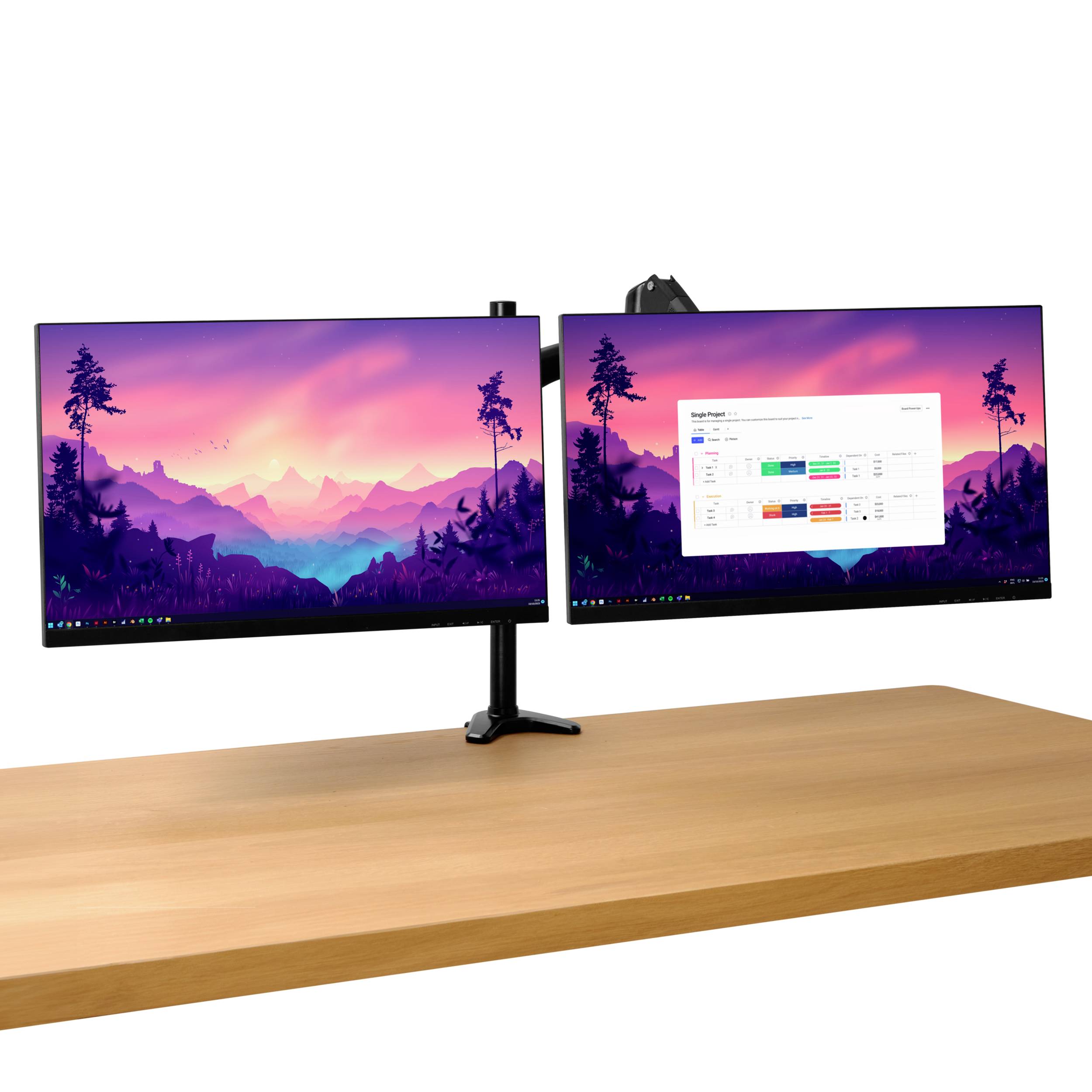 Two monitors on a wooden desk, both displaying a colourful landscape. The right monitor additionally shows a calendar document.
