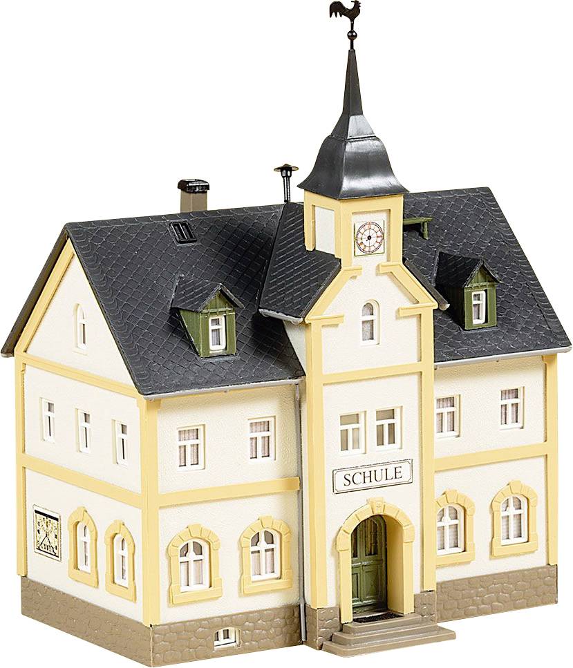 A model of a small building with the inscription 'School' above the door. The building has yellow frames, a pointed roof, and a weathervane.
