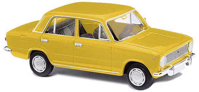 Yellow model car of the classic Soviet vehicle Lada, depicted in a side view with recognisable details such as headlights and wheels.