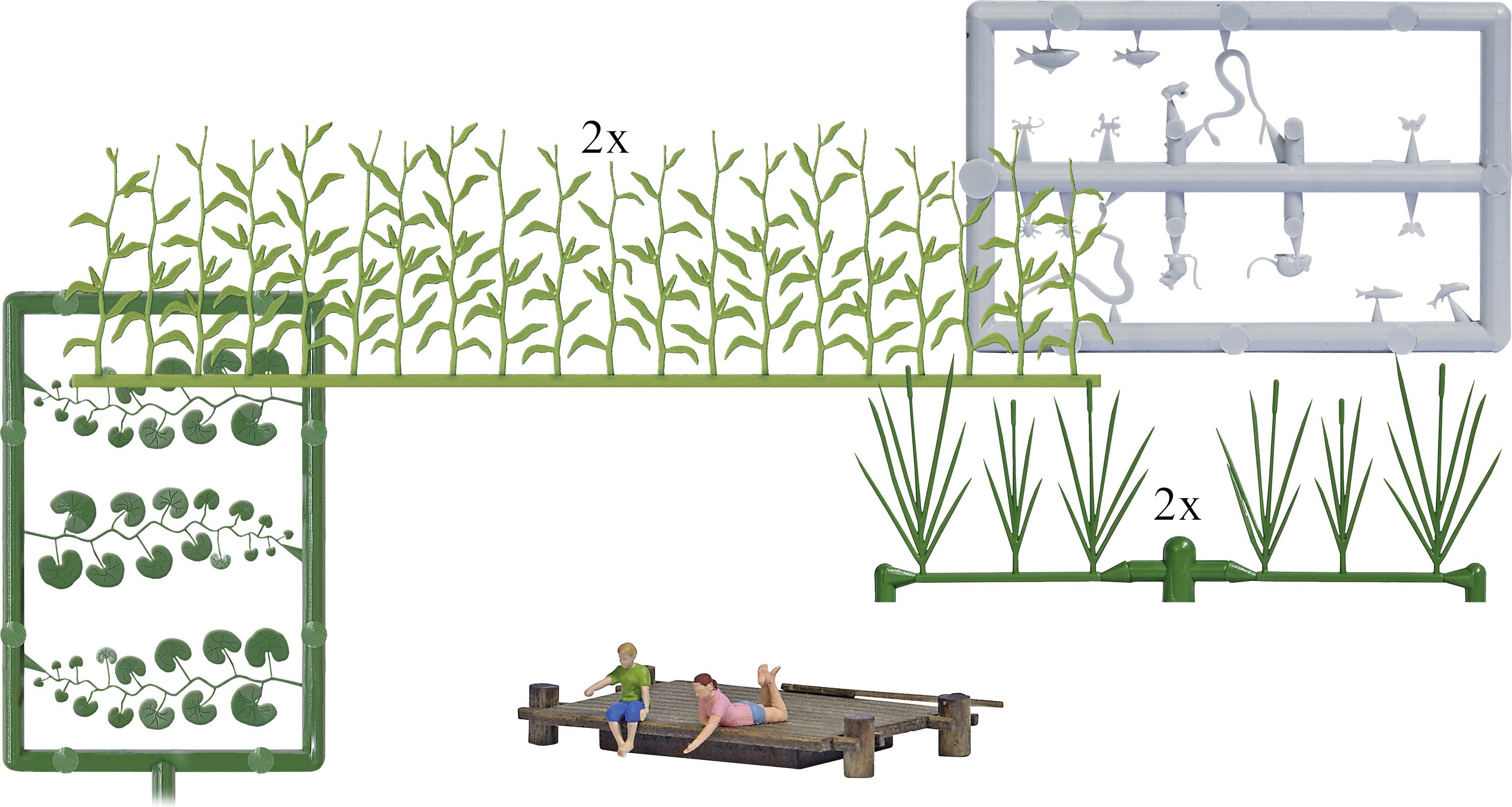 A plastic model kit with plant parts and figures, showing two people lying on a wooden walkway. Kit contains plants, animals, and figures.