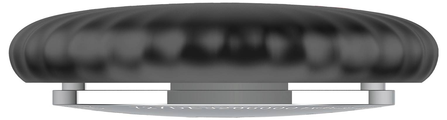 Black, smooth, round smoke detector viewed from the side, mounted on a white ceiling.