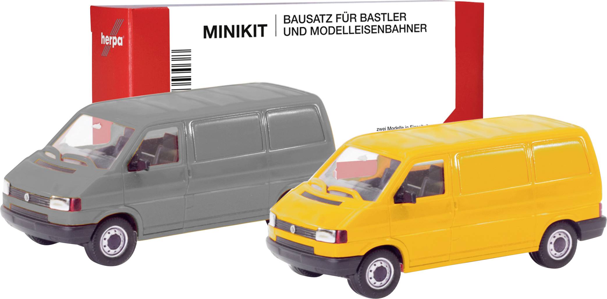 Gray and yellow model vehicles in front of a red package with the inscription 'Minikit Construction Kit for Hobbyists and Model Railway Enthusiasts'.