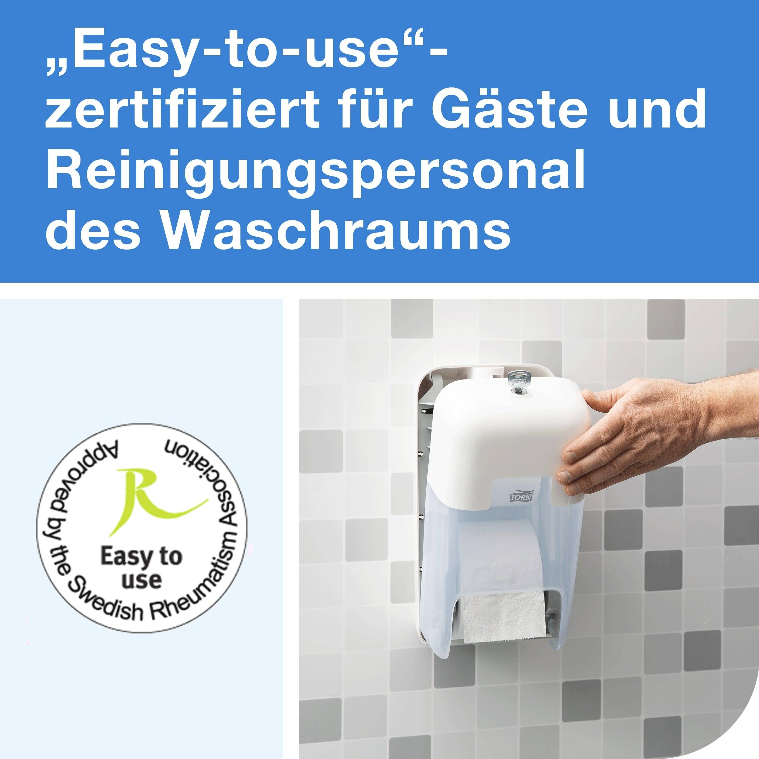 A hand towel dispenser on a tiled wall, with a hand pulling out paper towels. Left text: Certified 