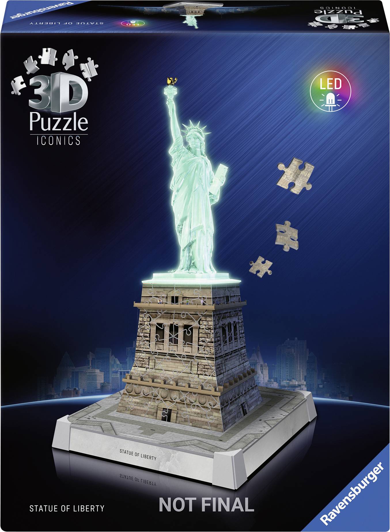 Ravensburger 3D Puzzle of the Statue of Liberty, glowing in Green with flying puzzle pieces. Packaging front with LED indication.