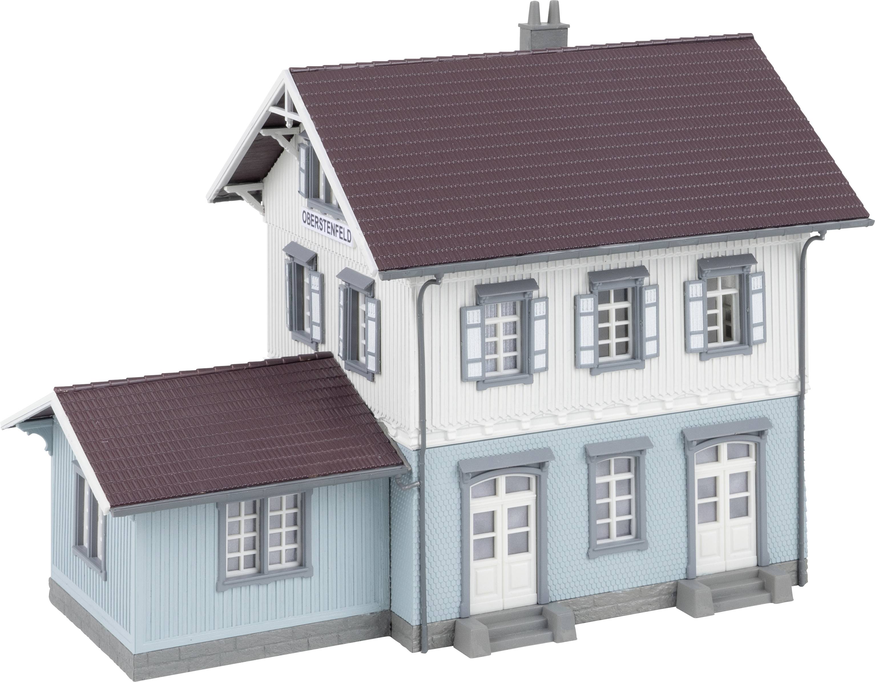A model of a two-storey house with a blue façade, red roofs and dormer windows. The inscription 'Oberried' is on the façade.