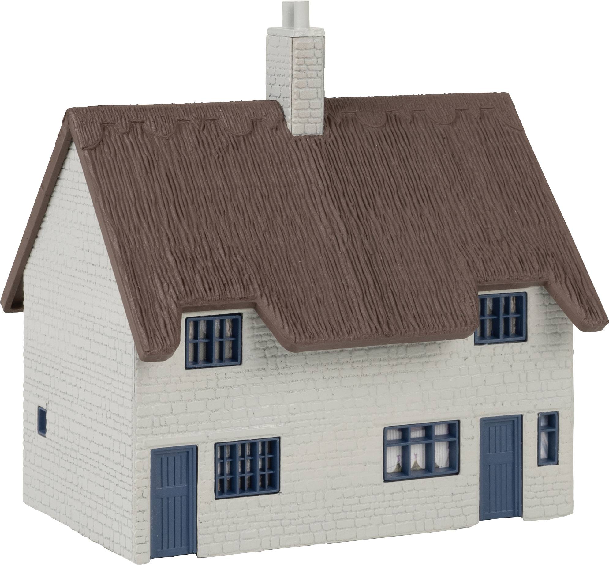 A small model house with a thatched roof, blue windows and doors. It looks like a traditional country cottage.