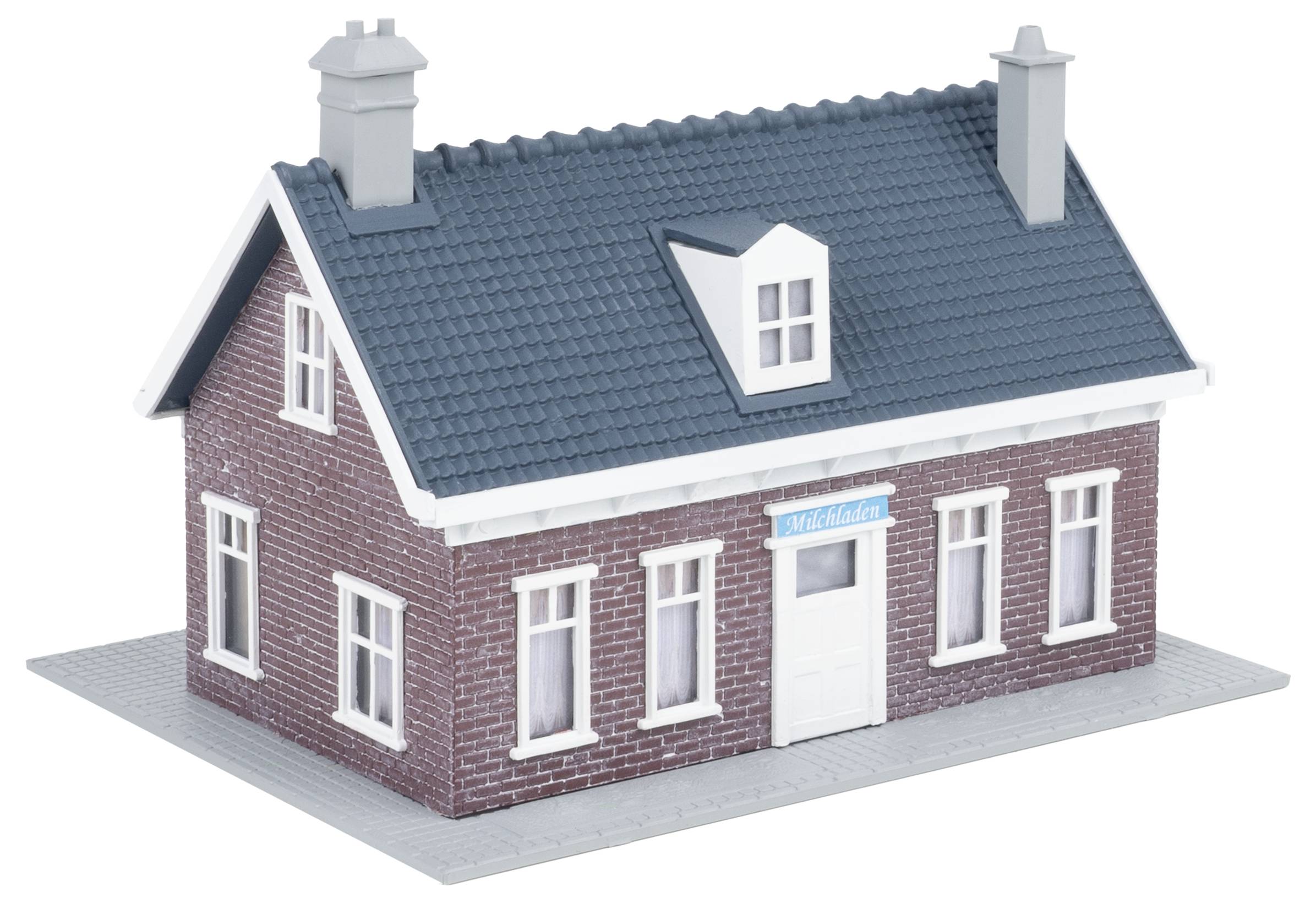 A small model house built from red brick with blue roof tiles and white window frames.