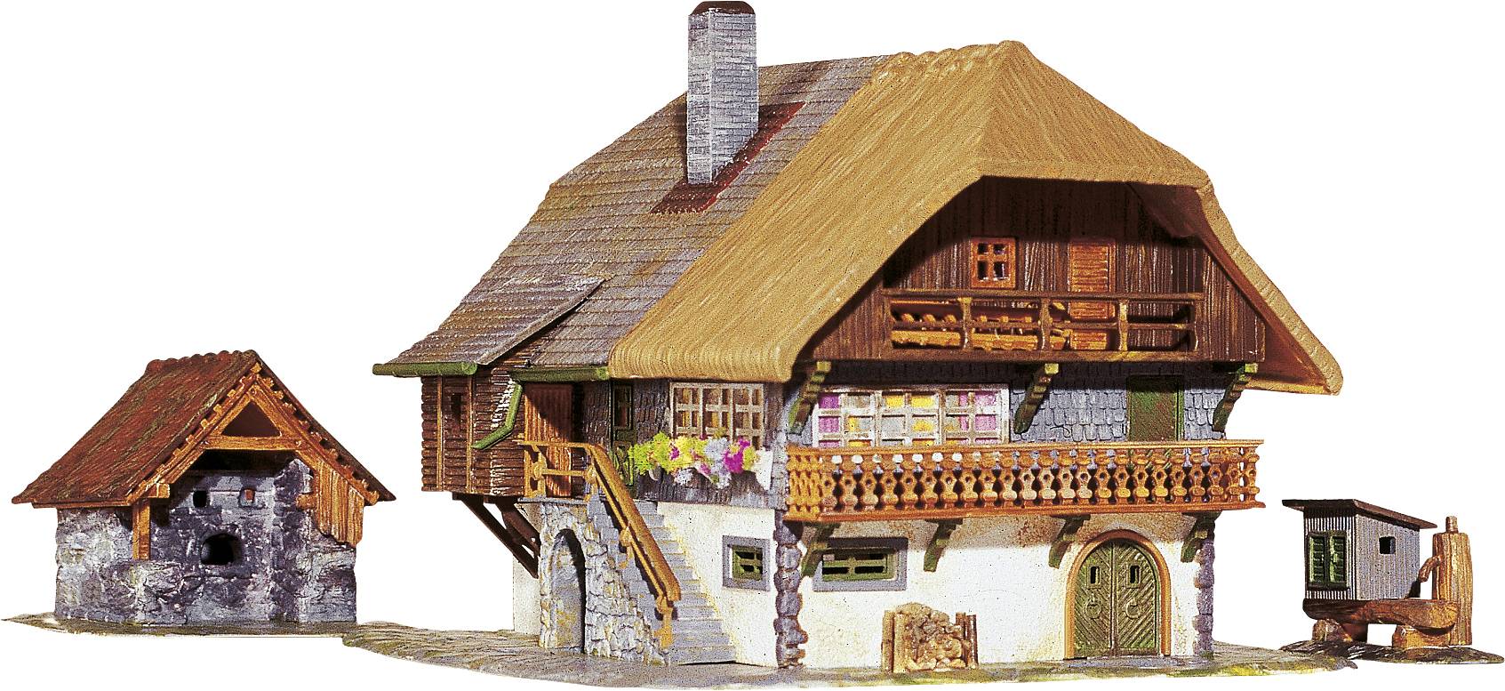 A traditional half-timbered house with a thatched roof. Next to the house, a smaller shed and a wooden well. Flowers adorn the window sill.