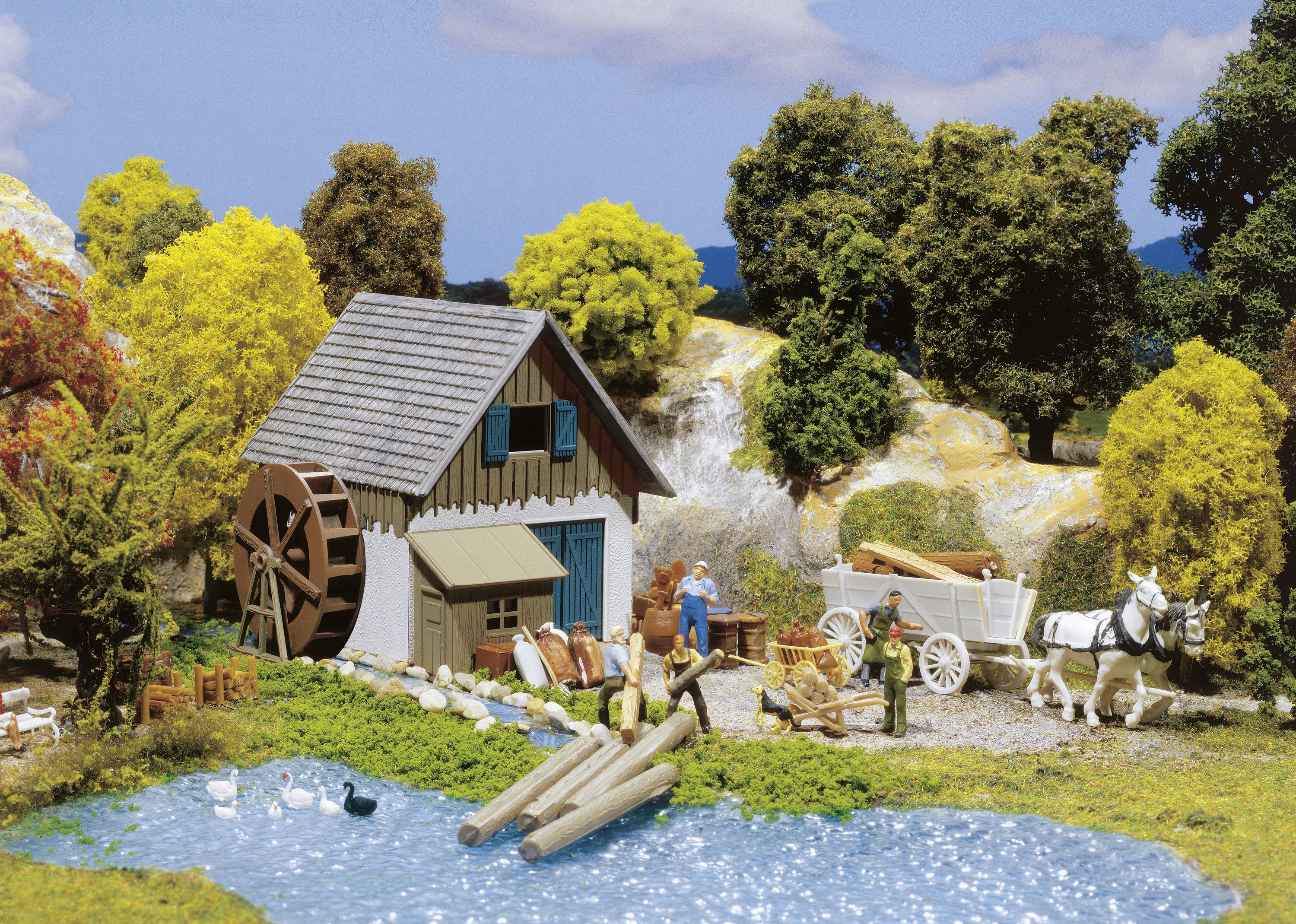 Miniature scene: An old watermill beside a pond, surrounded by trees. People are loading wood onto a horse-drawn carriage. Ducks are swimming in the water.