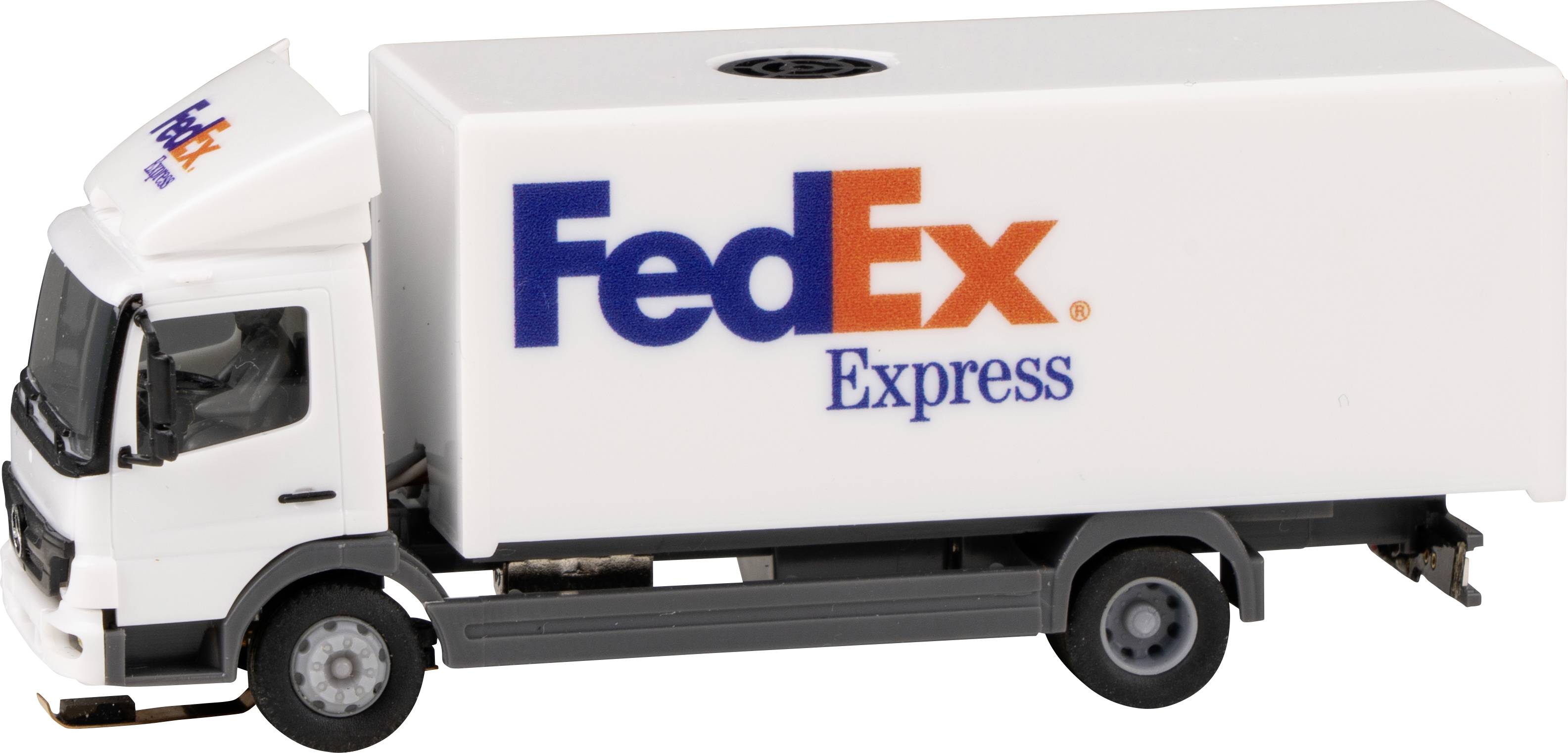 Small FedEx delivery van made of plastic in white with blue and orange company logos on the side and cab.