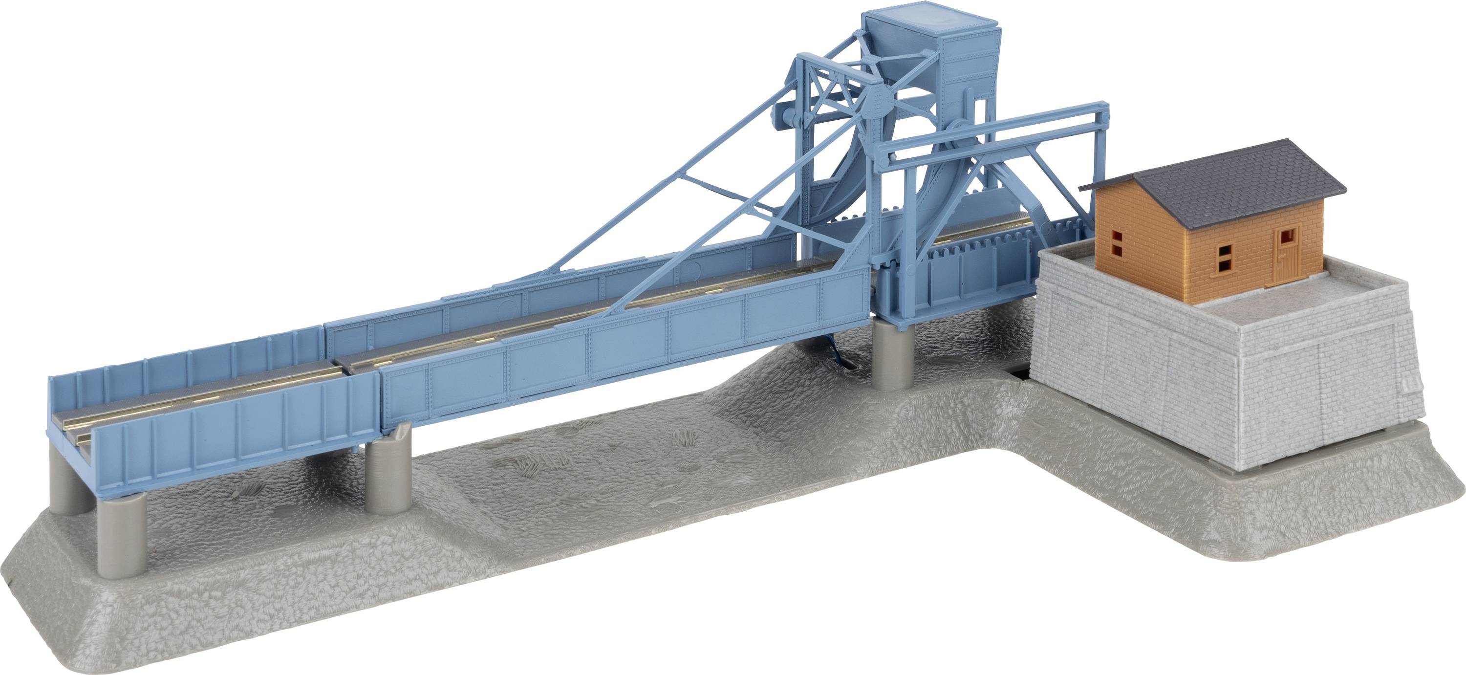 A miniature machine installation with a blue conveyor belt and small building on a grey base, likely for model-building purposes.