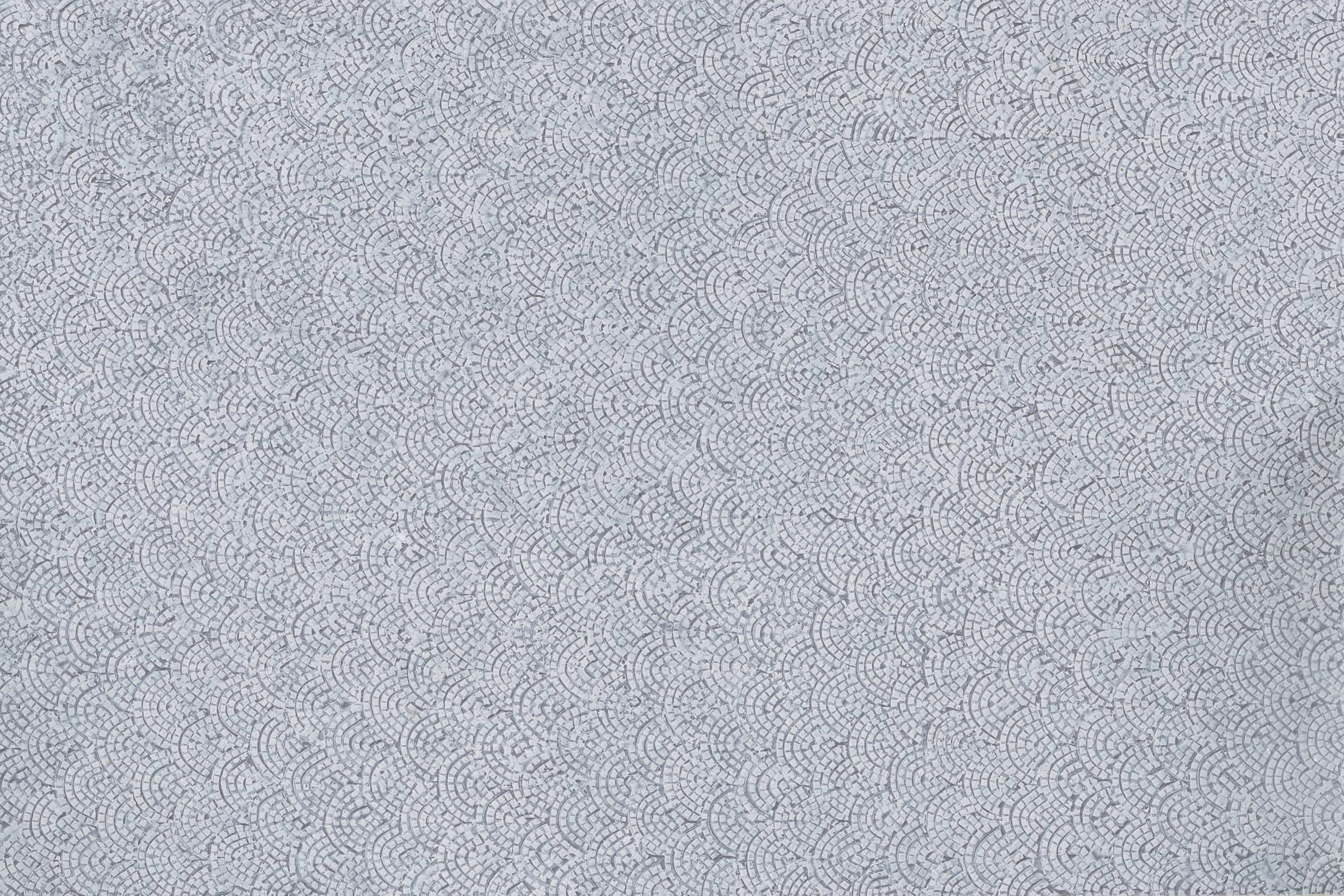 A structured, grey pattern with fine wavy lines that evokes a textile surface.