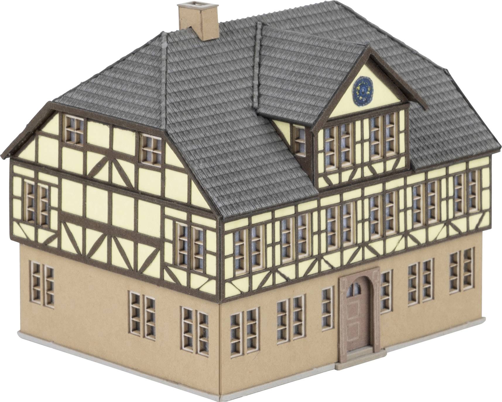 Timber-framed house model, yellow walls with brown wooden beams, grey roof, blue plaque on top.
