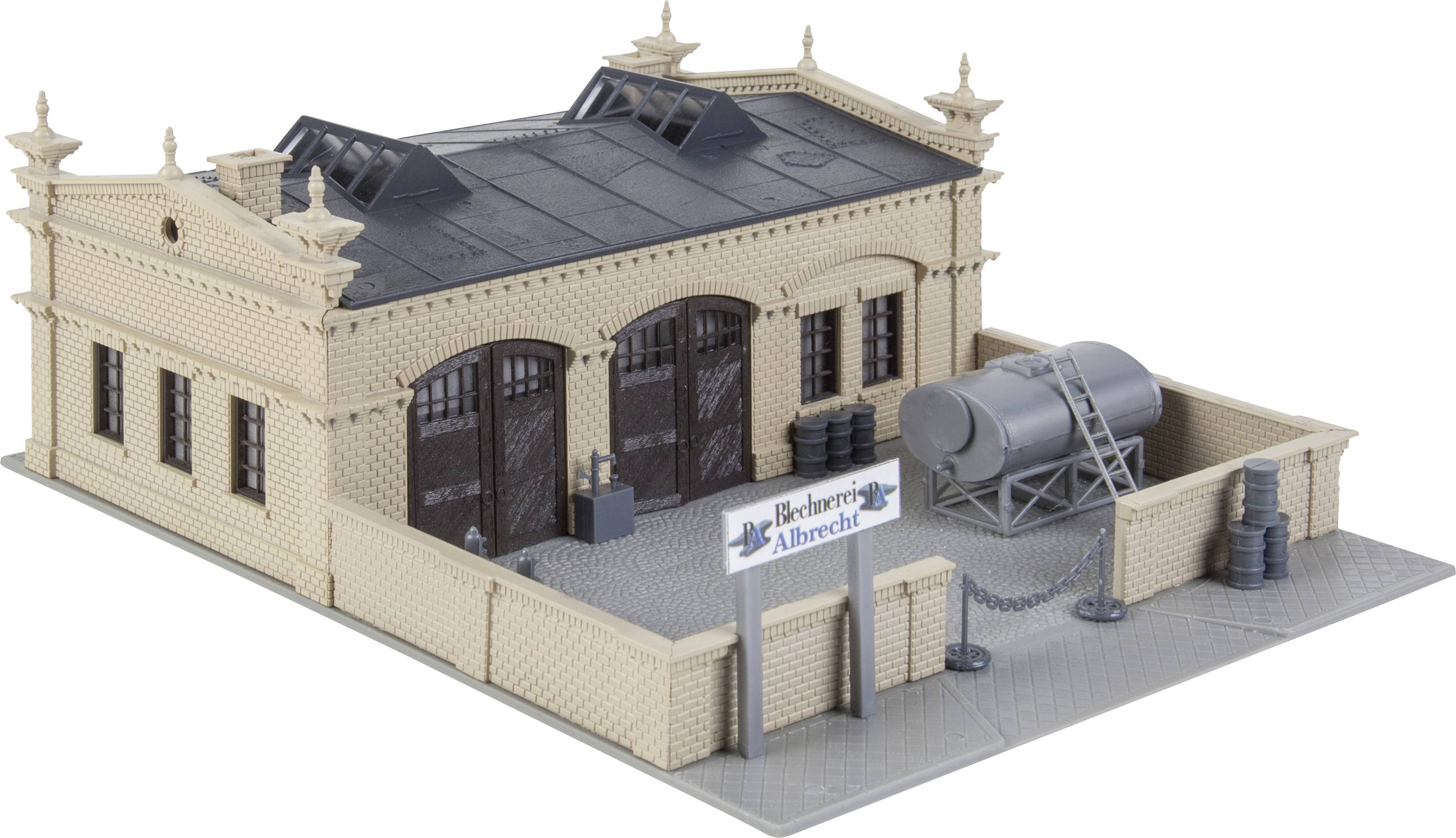 Brick building with two large doors, ventilation shafts above. A large tank stands to the side. Sign: 'Albrecht Brewery'.